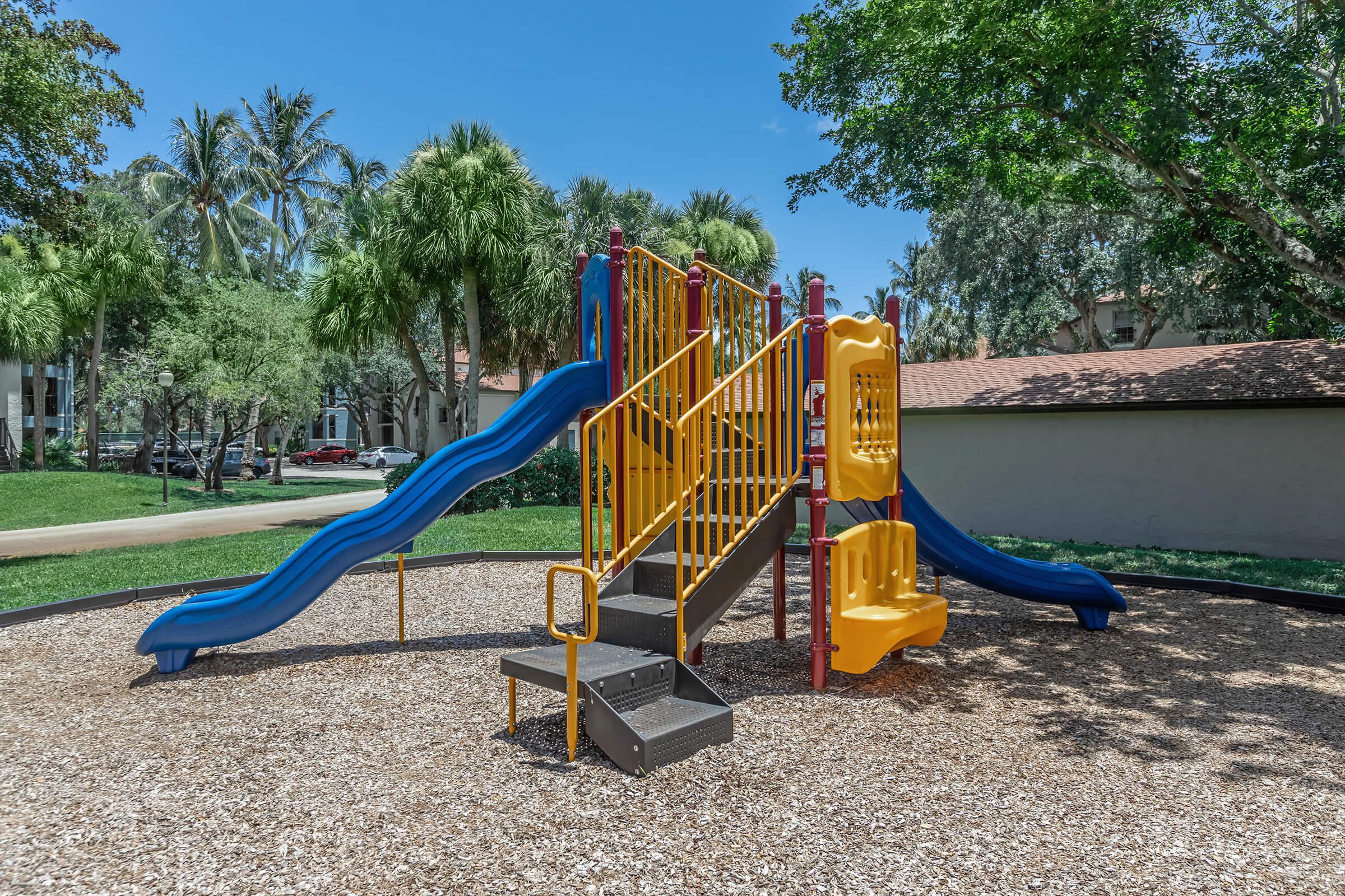 a playground in front of a slide