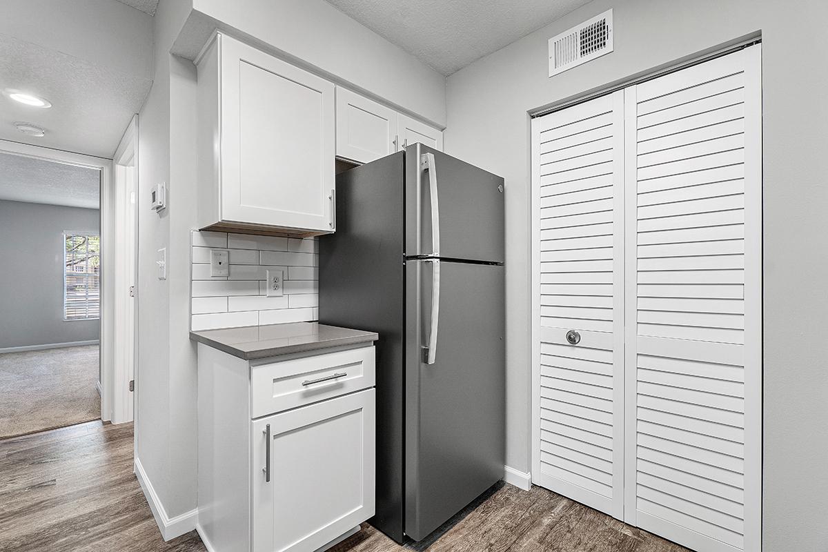 a white refrigerator freezer sitting inside of a kitchen