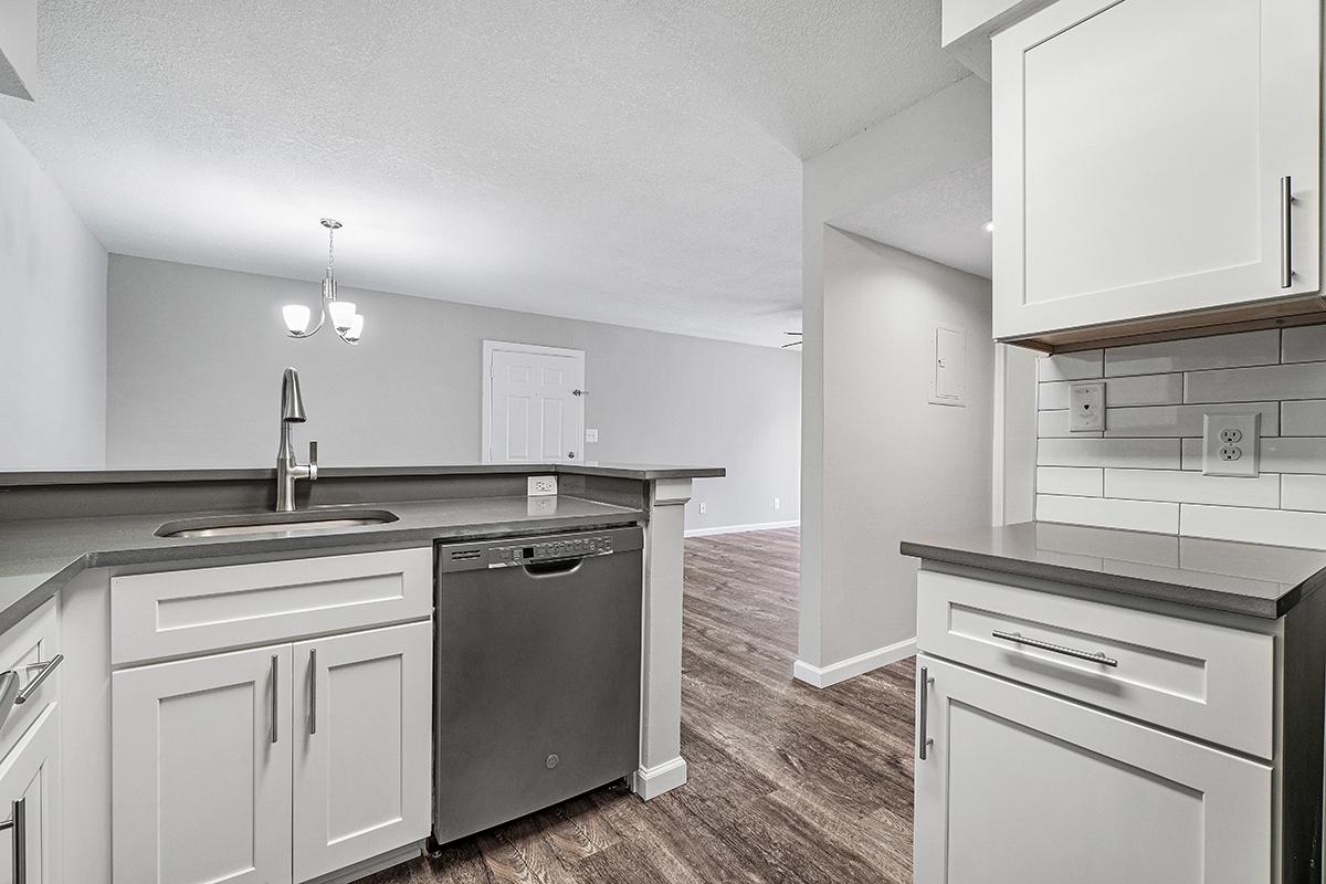 a kitchen with a sink and a refrigerator