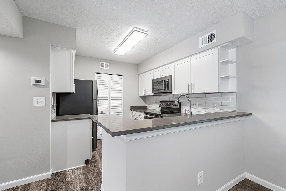 a white refrigerator freezer sitting inside of a kitchen