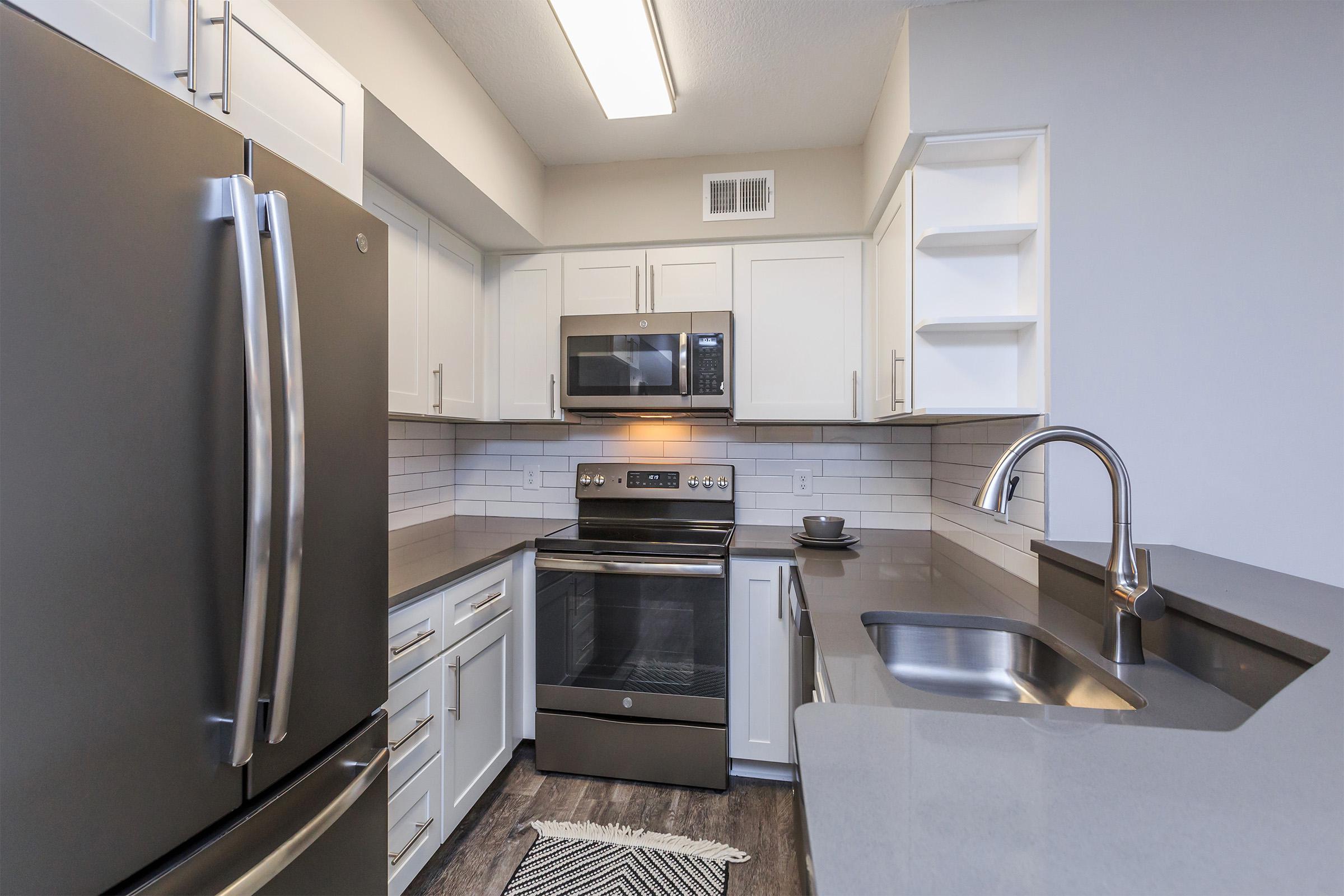 a stainless steel refrigerator in a kitchen