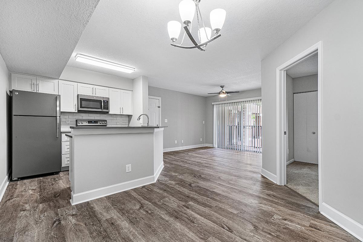 a kitchen with a wooden floor