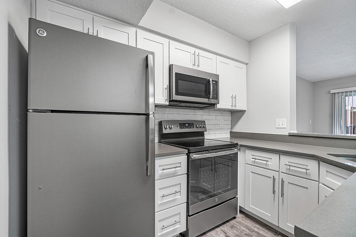 a stainless steel refrigerator in a kitchen