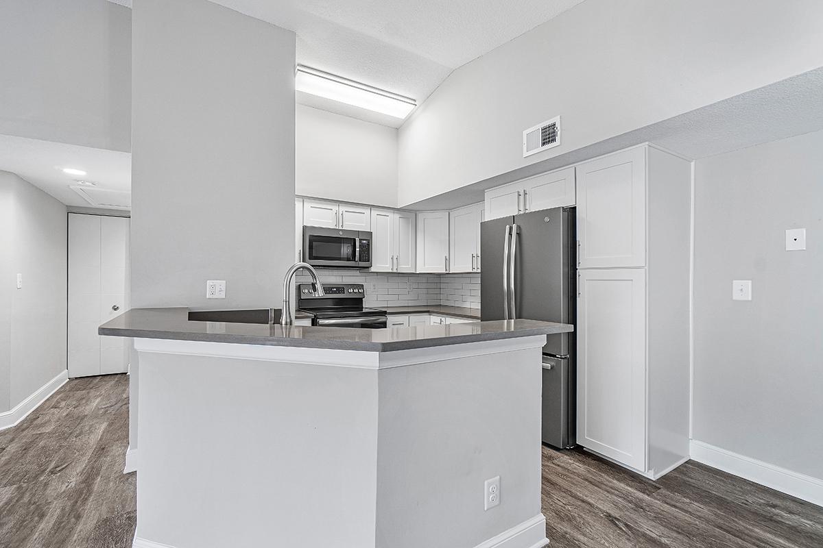 a large white refrigerator in a kitchen