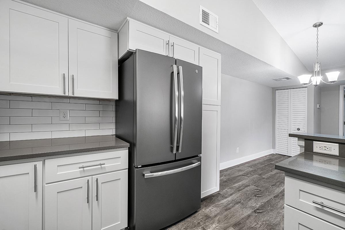 a large white refrigerator in a kitchen