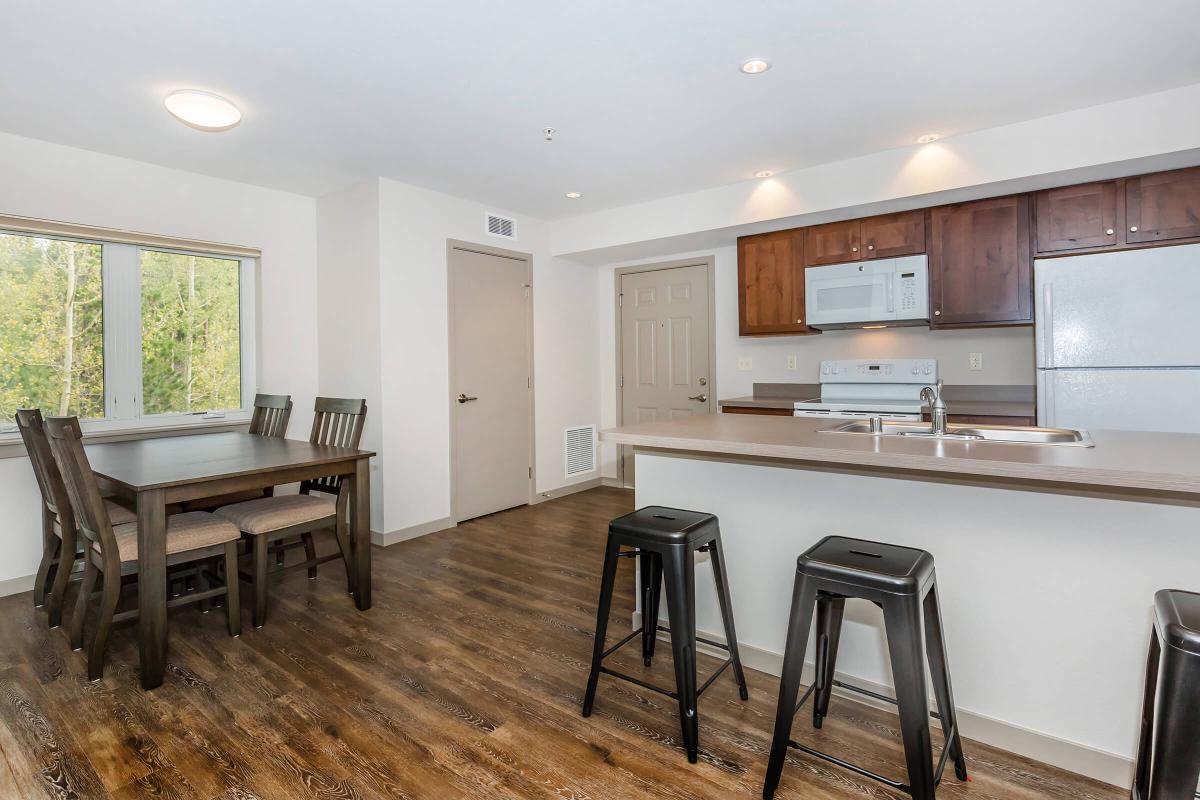 a kitchen with a dining room table