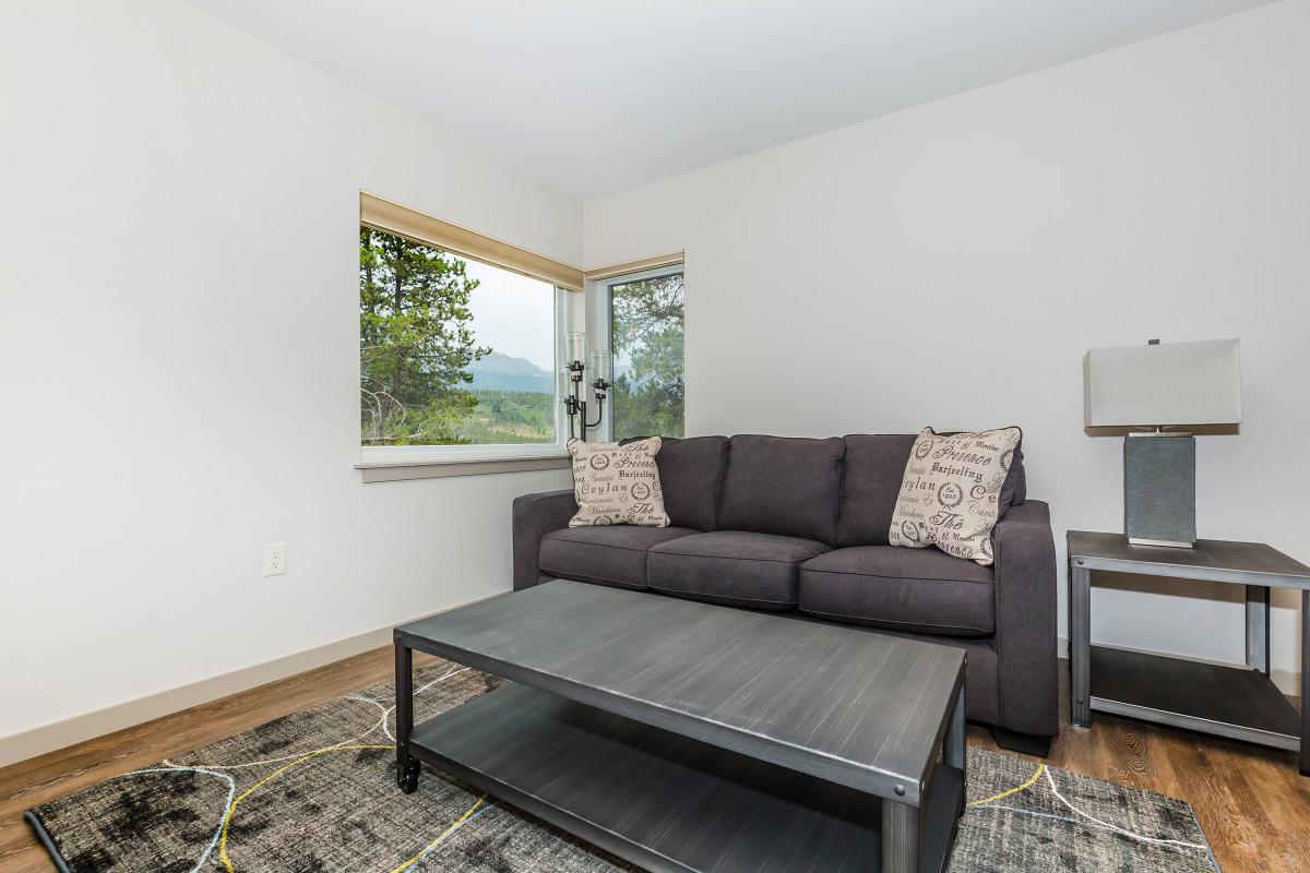 a brown leather couch in a living room