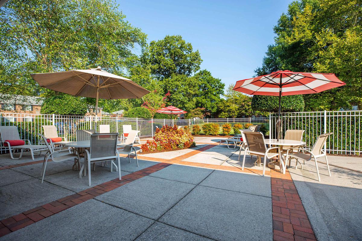 a group of lawn chairs sitting on top of a picnic table