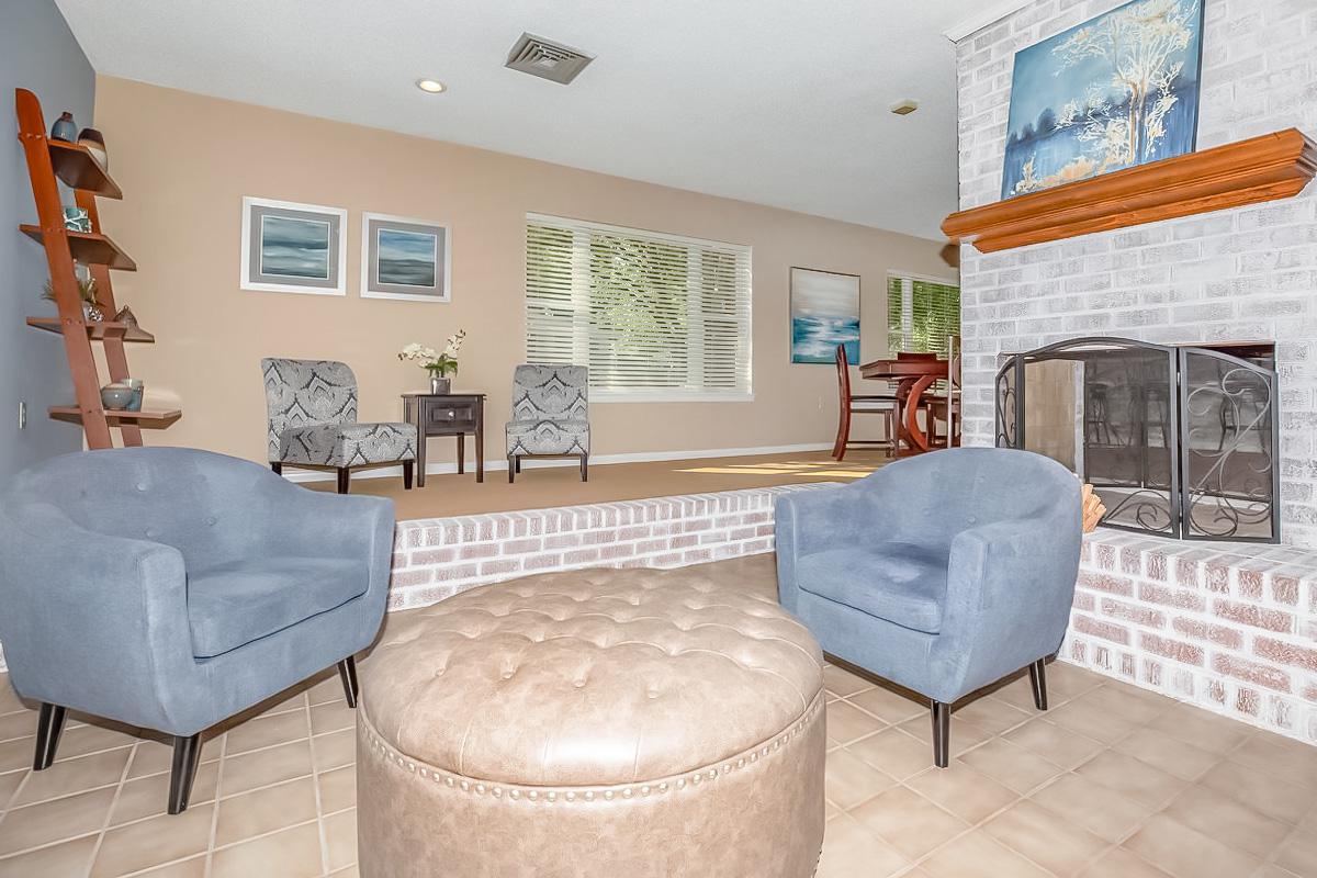 a living room filled with furniture and a fireplace