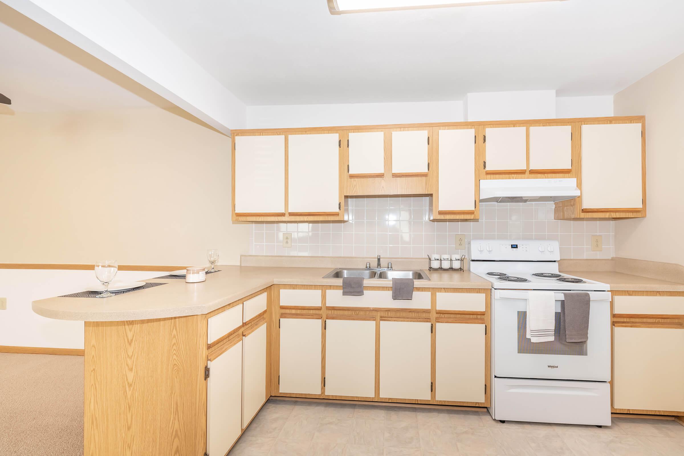 a kitchen with a stove and a sink