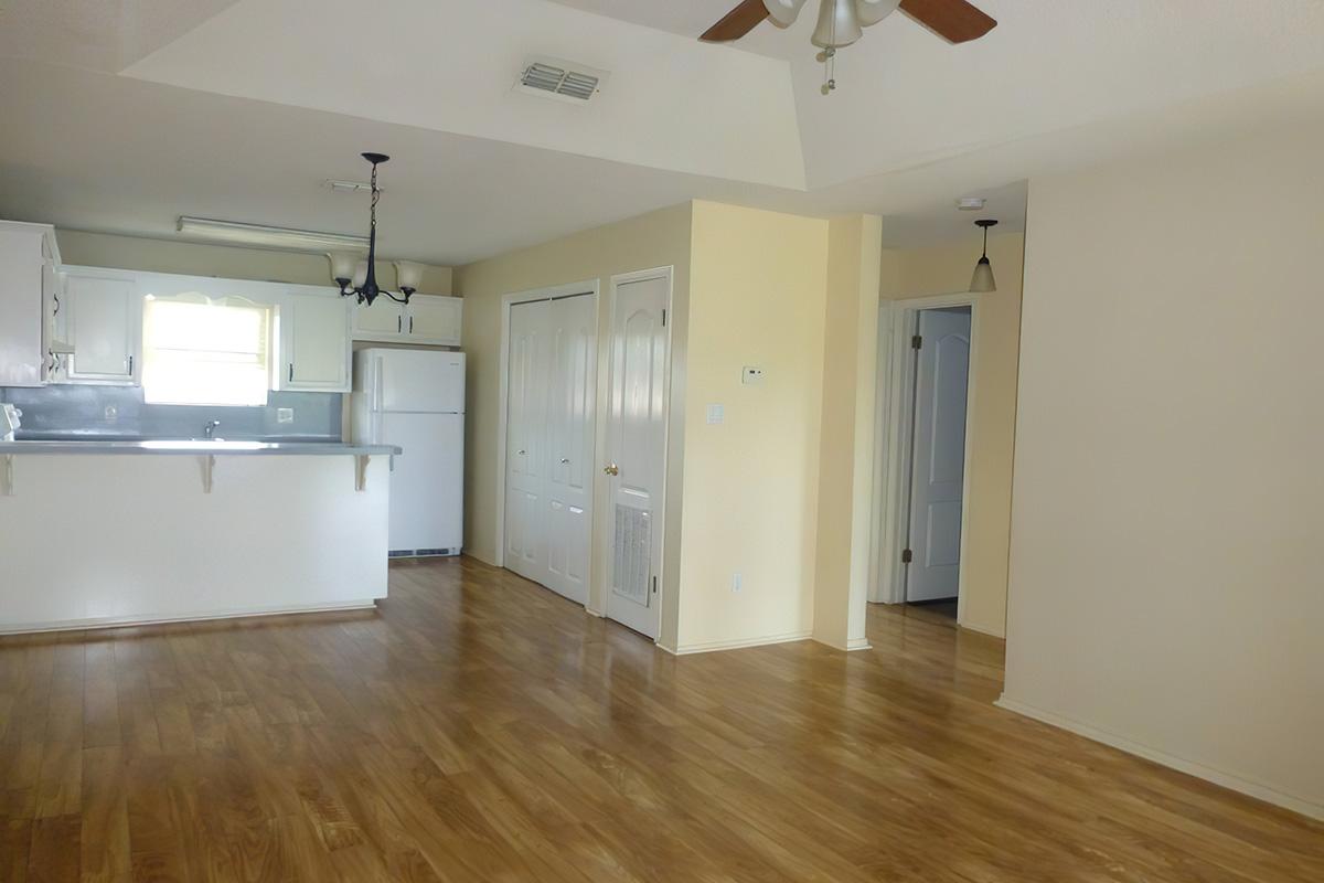 a large empty room with a hard wood floor