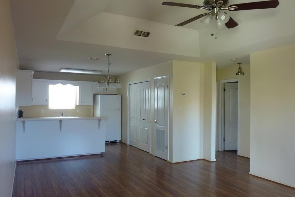 a large empty room with a wood floor