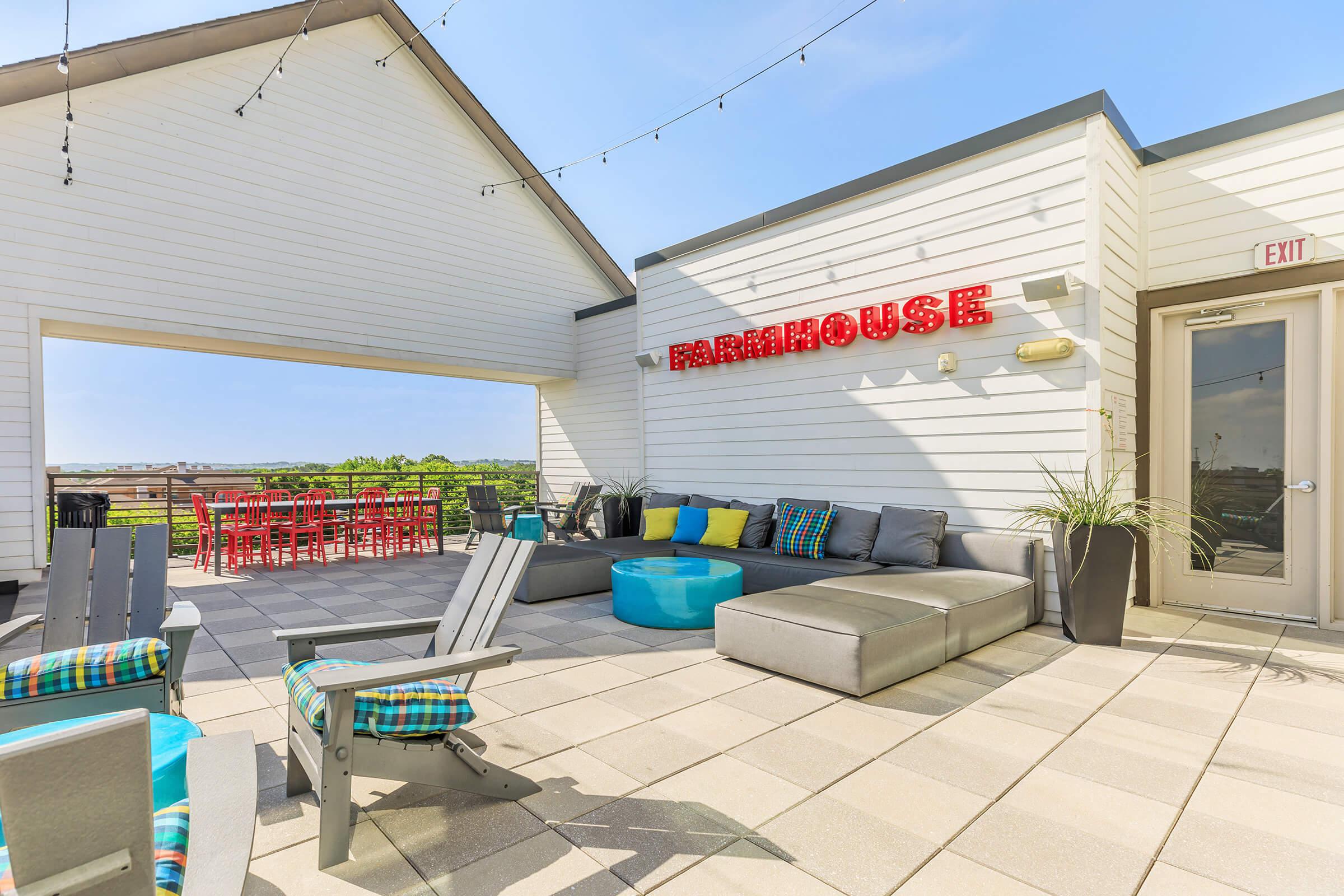 furnished outdoor area with couches and chairs