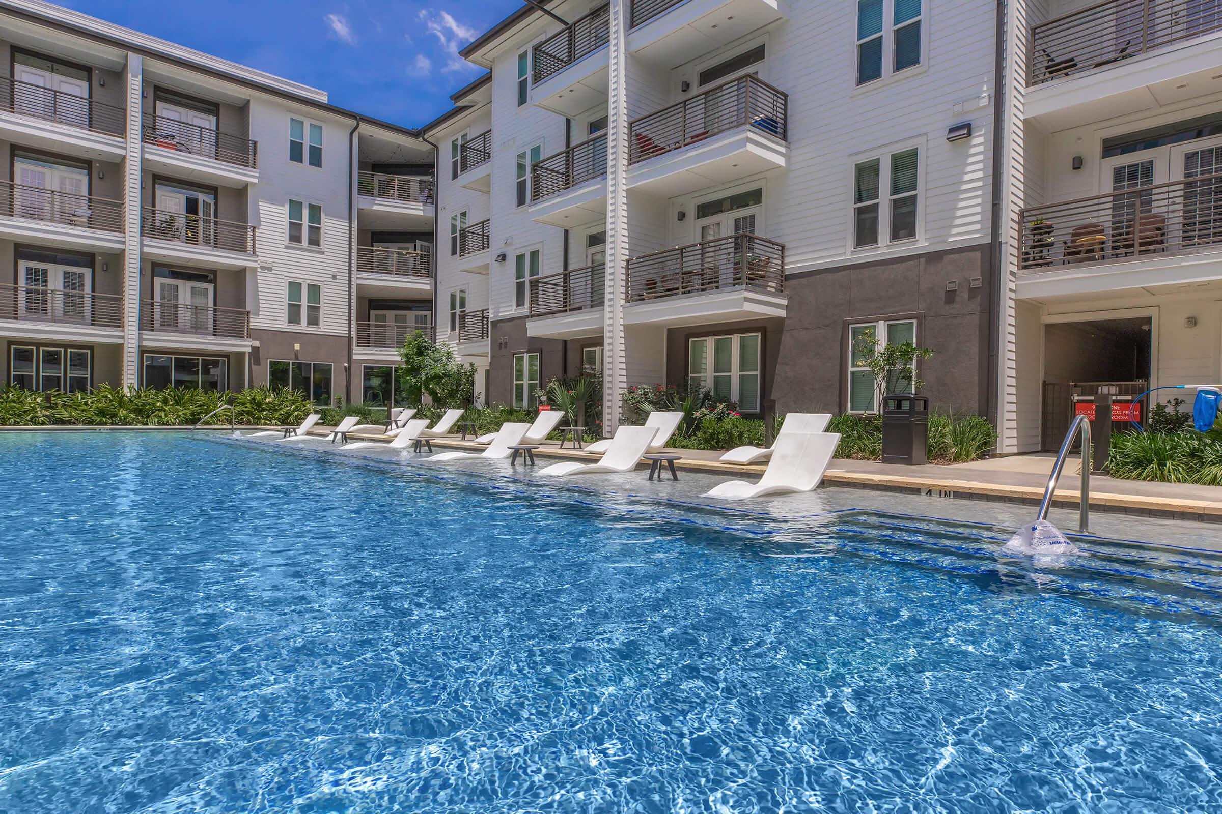 a large pool of water in front of a building