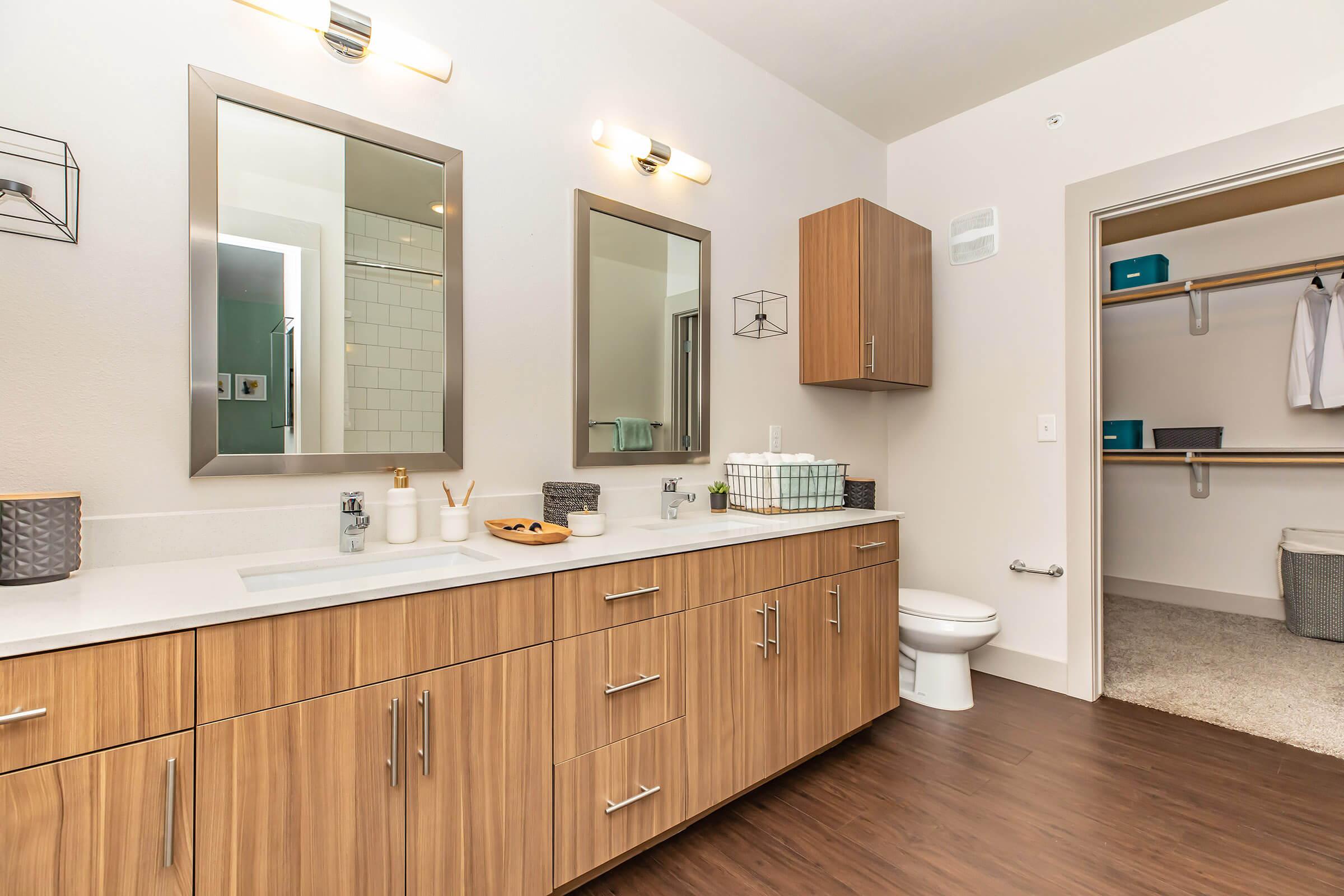 a kitchen with a sink and a mirror