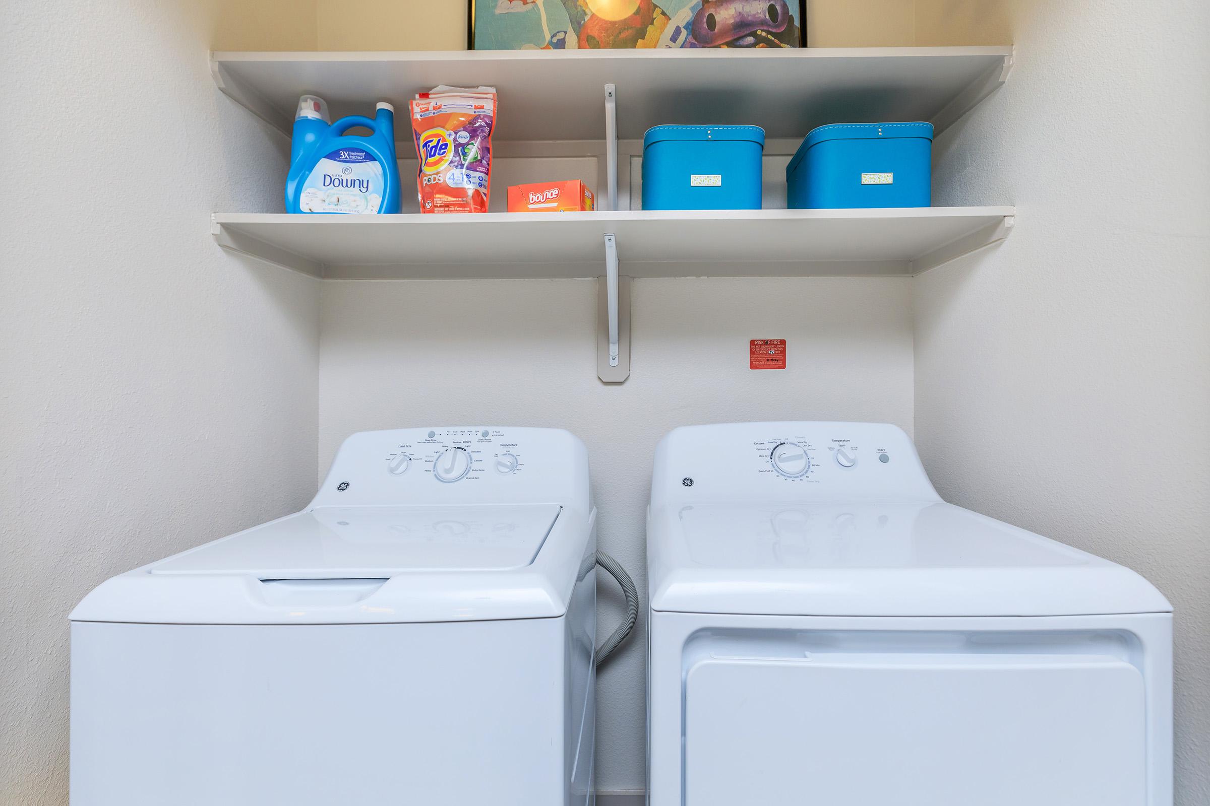 a washer and dryer in the laundry closet