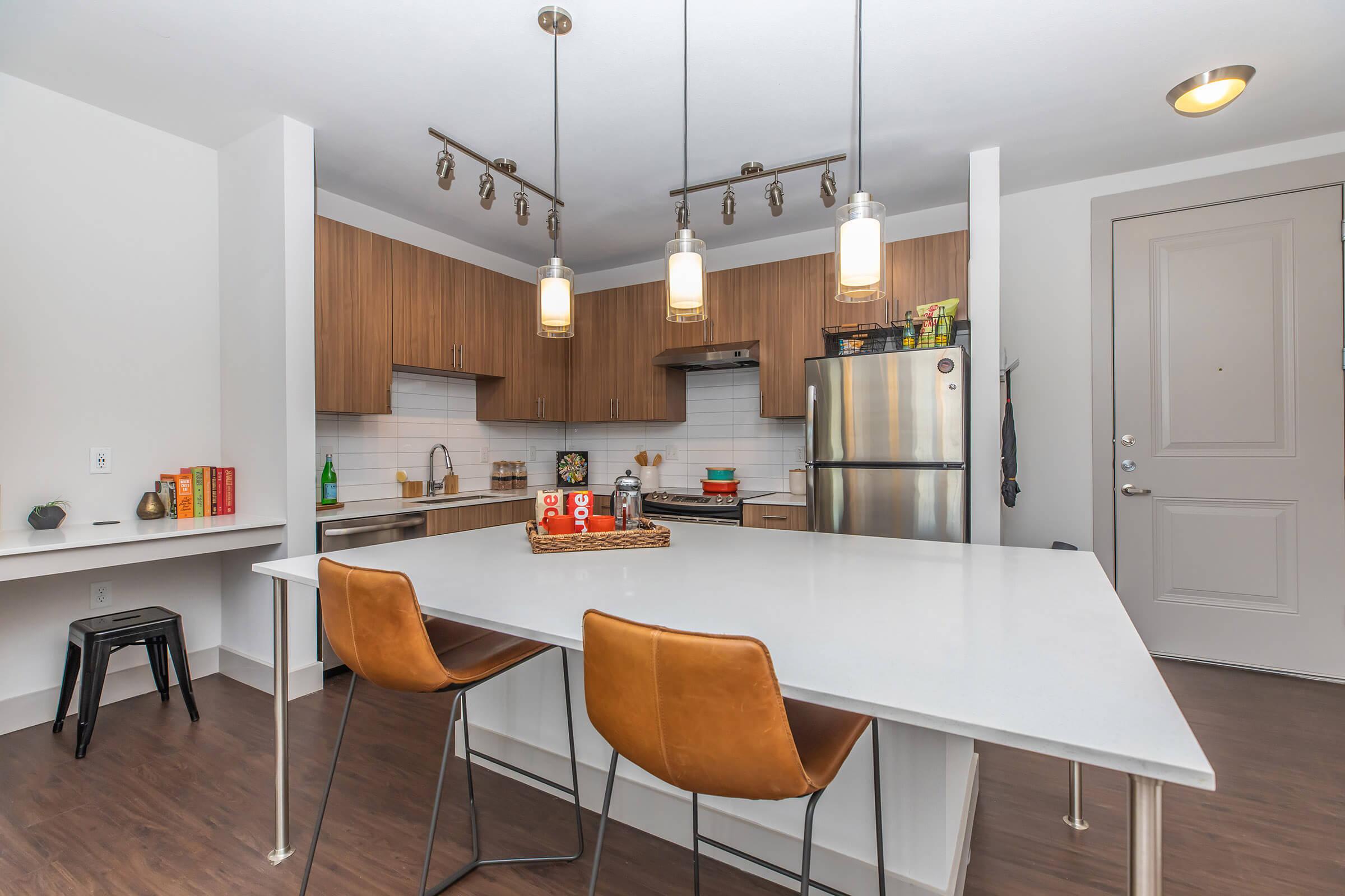 a kitchen with a wooden floor