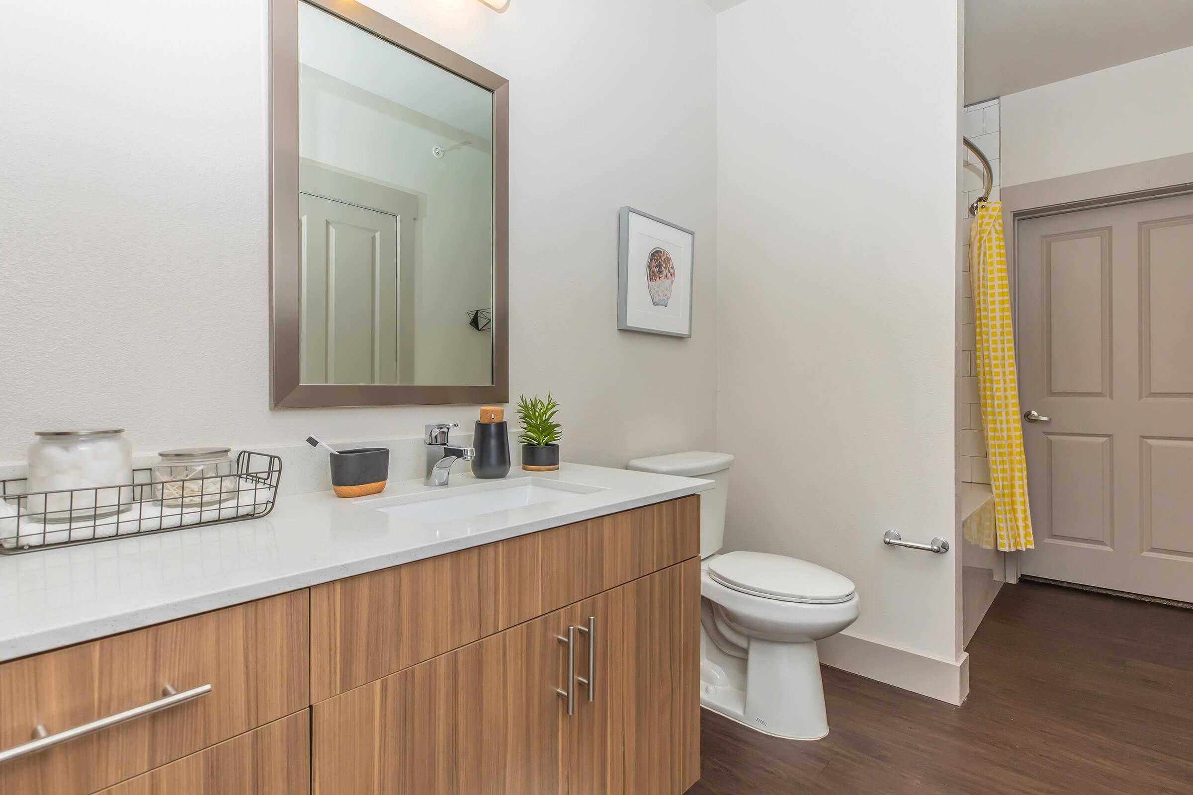 a kitchen with a sink and a mirror