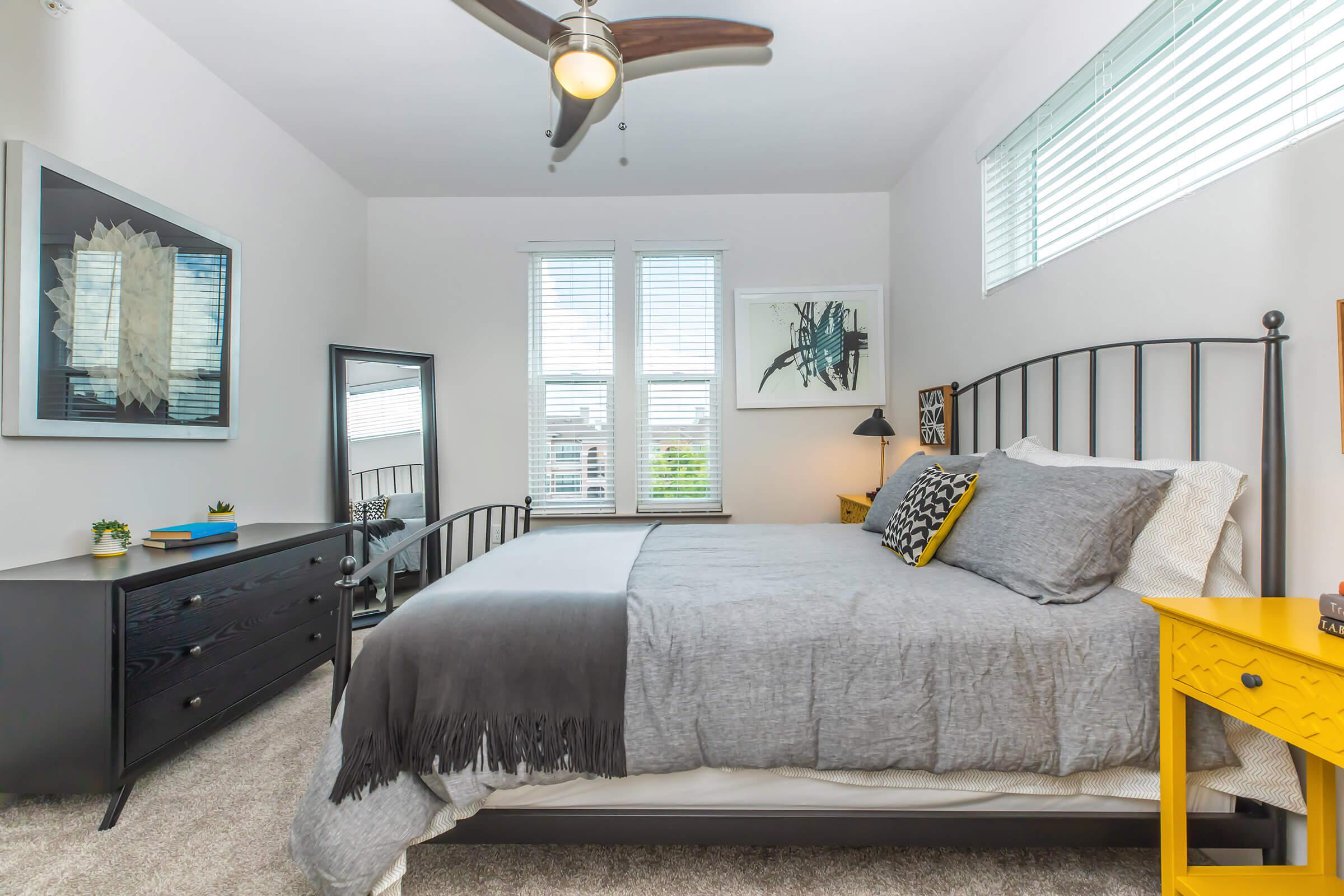 a furnished bedroom with carpet