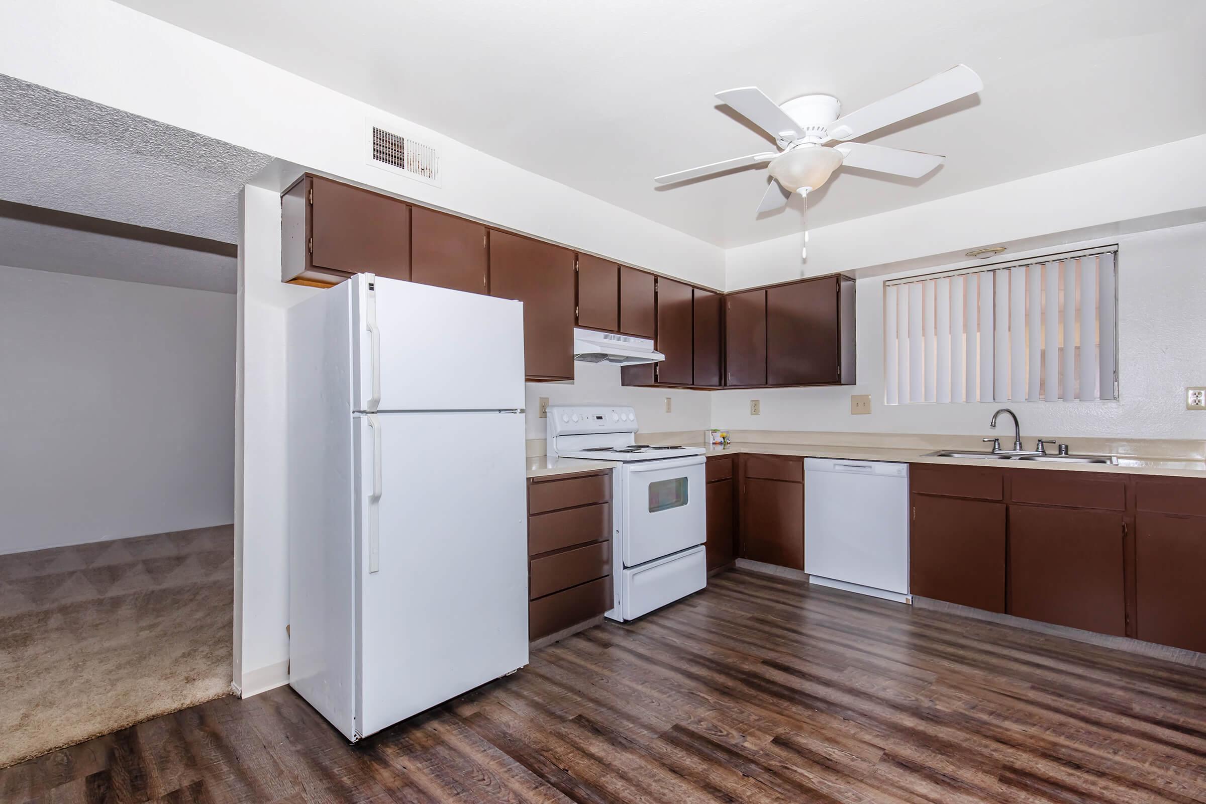 a kitchen with a wood floor