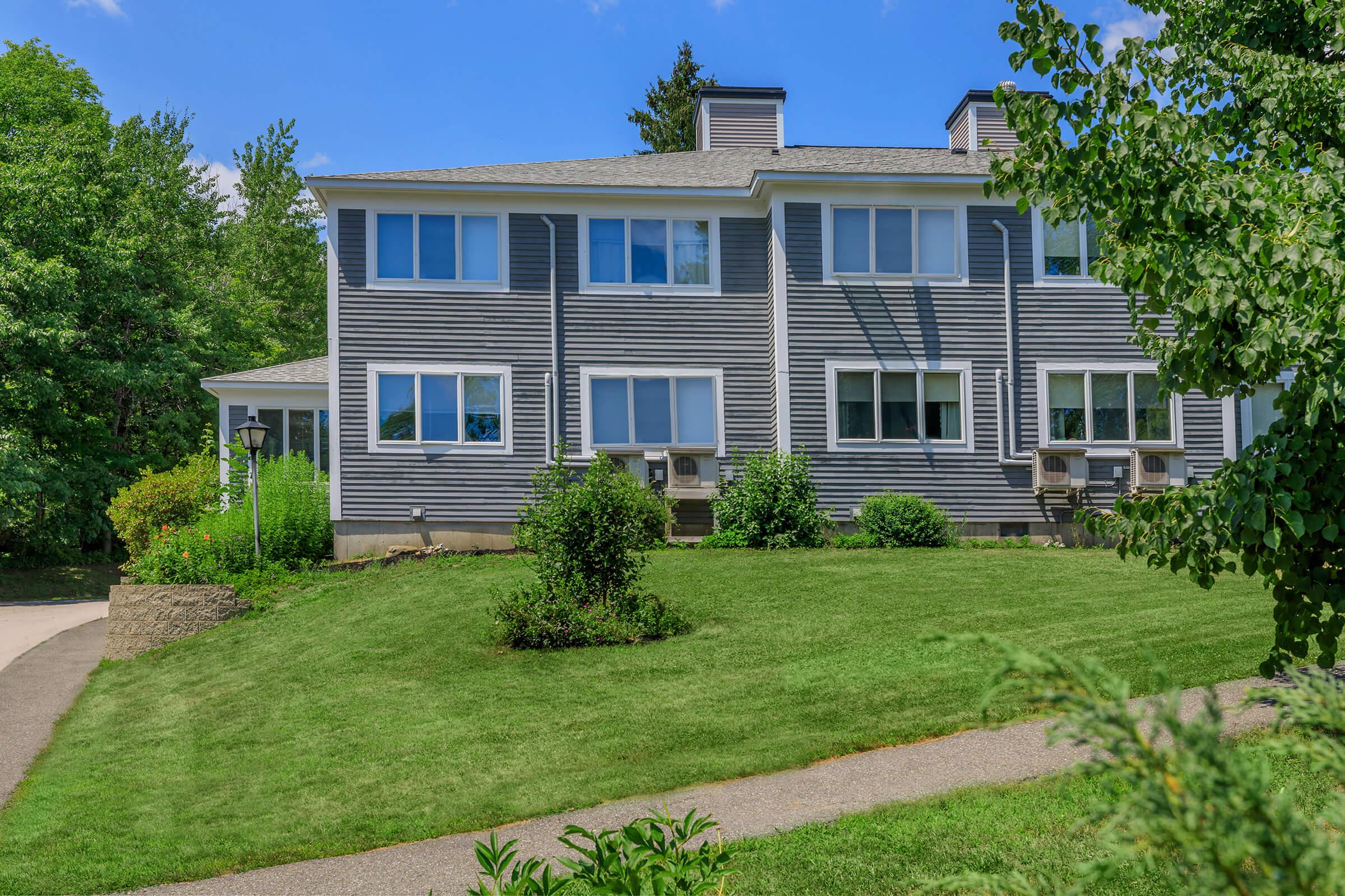 a large lawn in front of a house