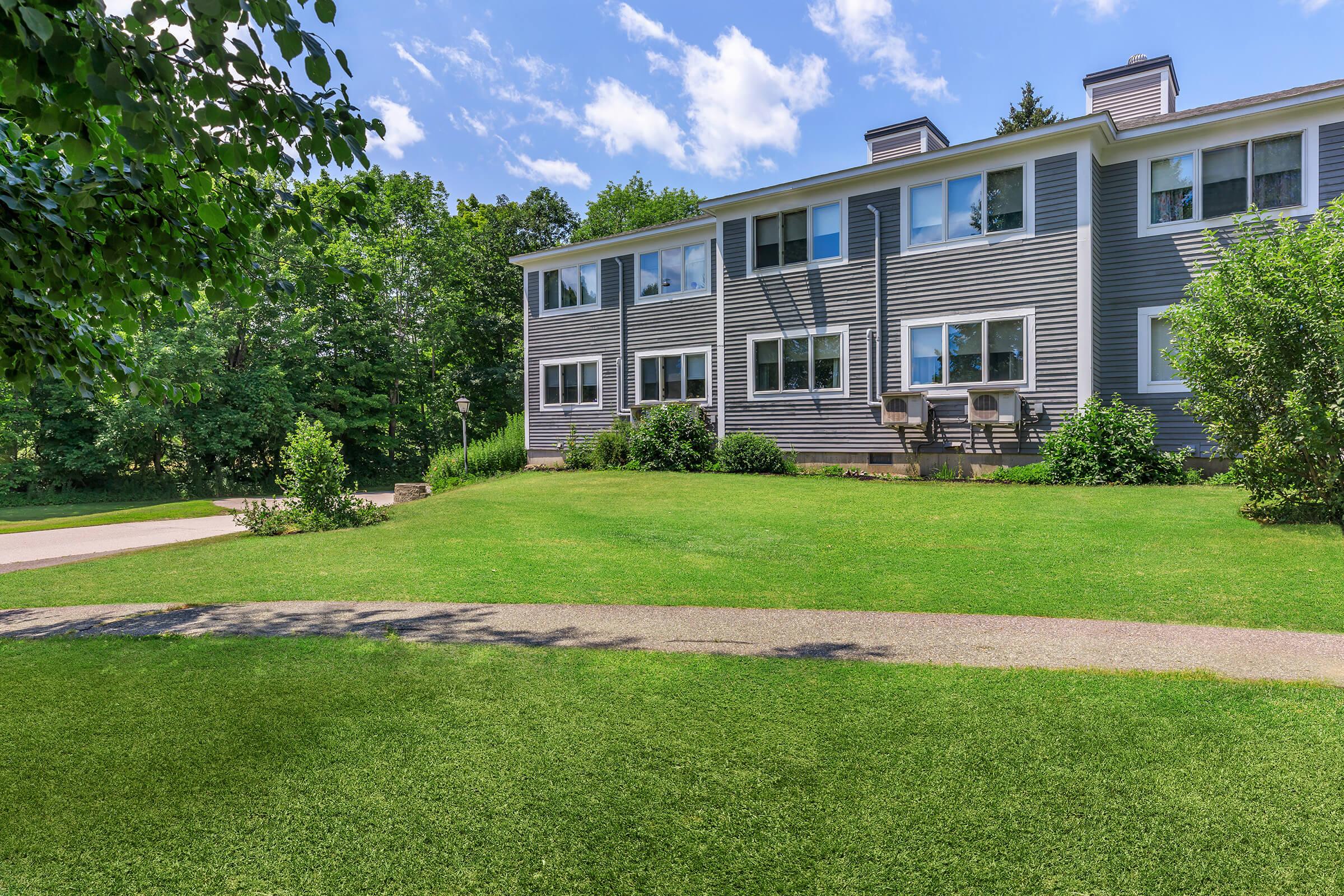 a large lawn in front of a house