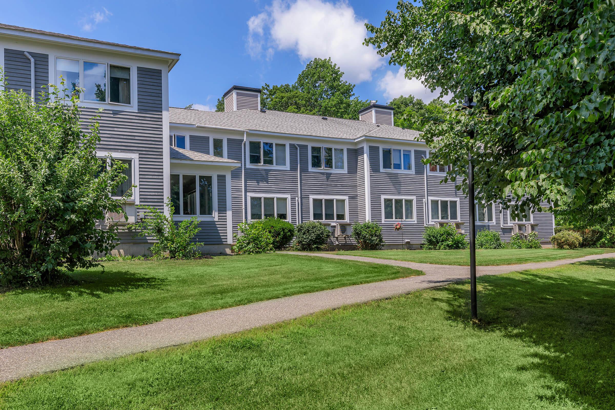 a large lawn in front of a house