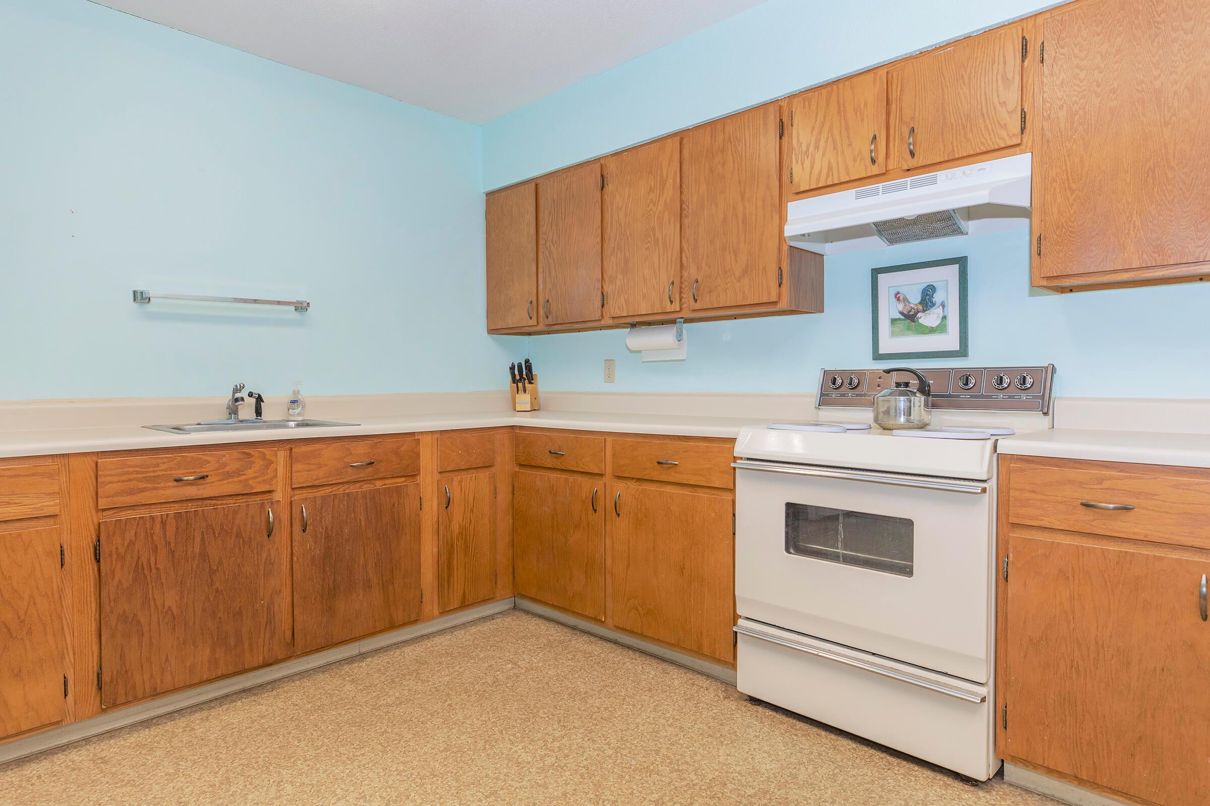 a kitchen with a stove and a refrigerator