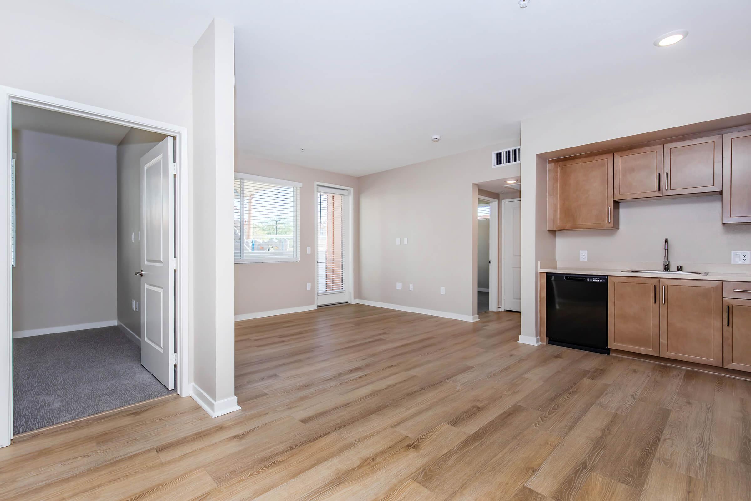 a large empty room with a wooden floor