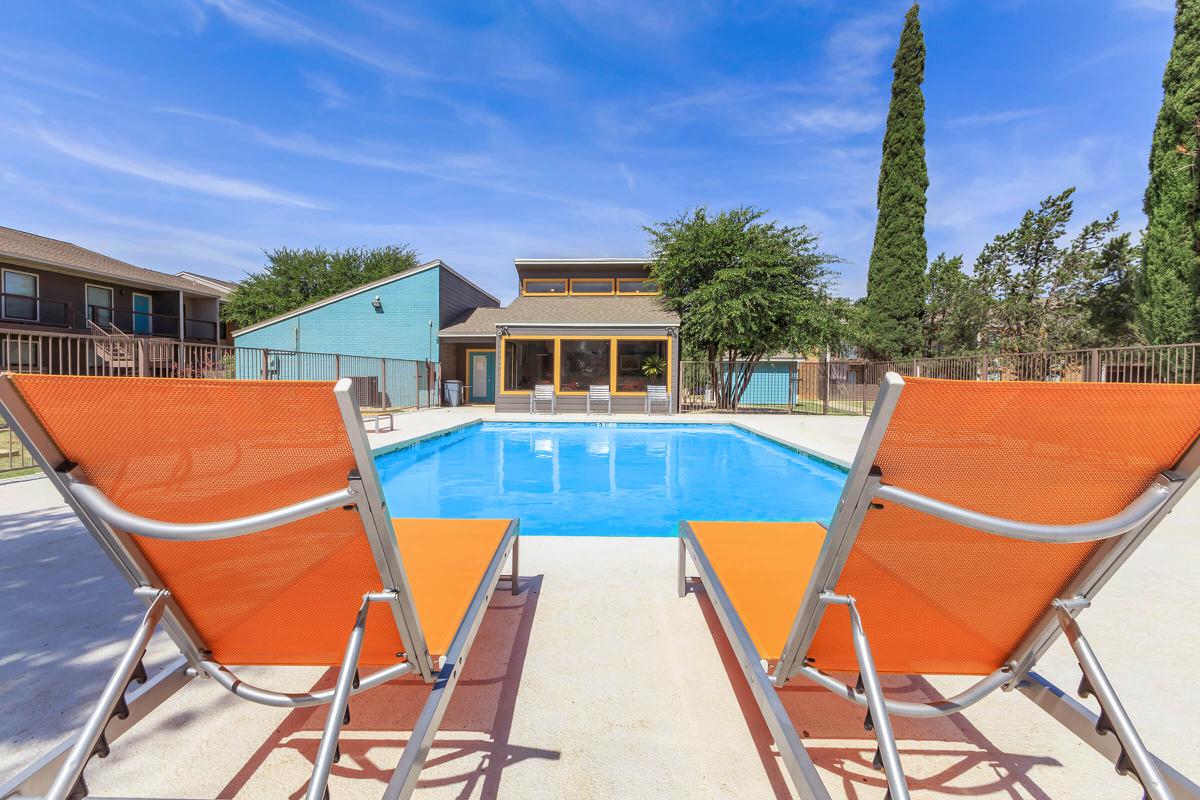 a chair sitting in front of a pool