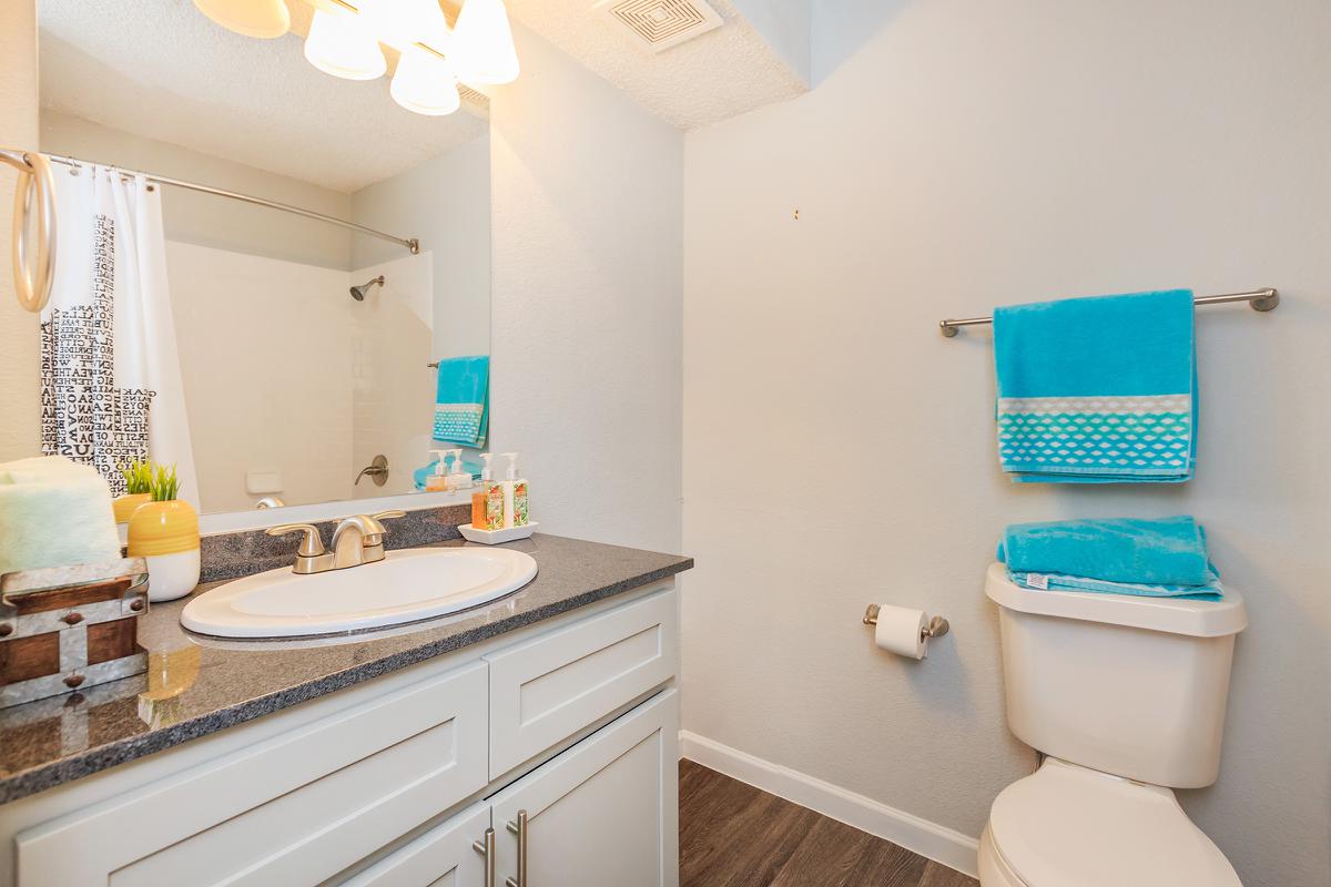 a kitchen with a sink and a mirror