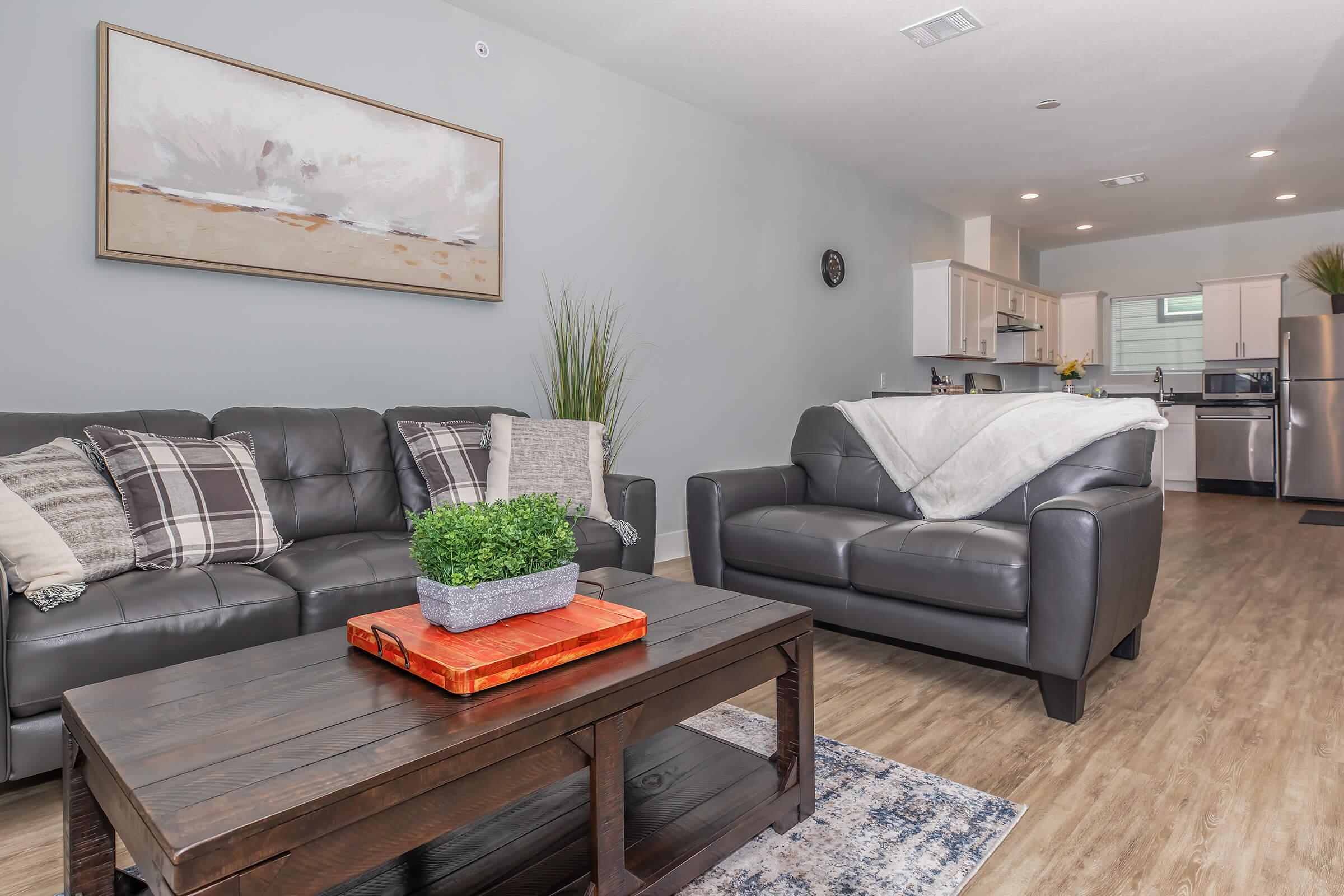 a living room filled with furniture and a flat screen tv