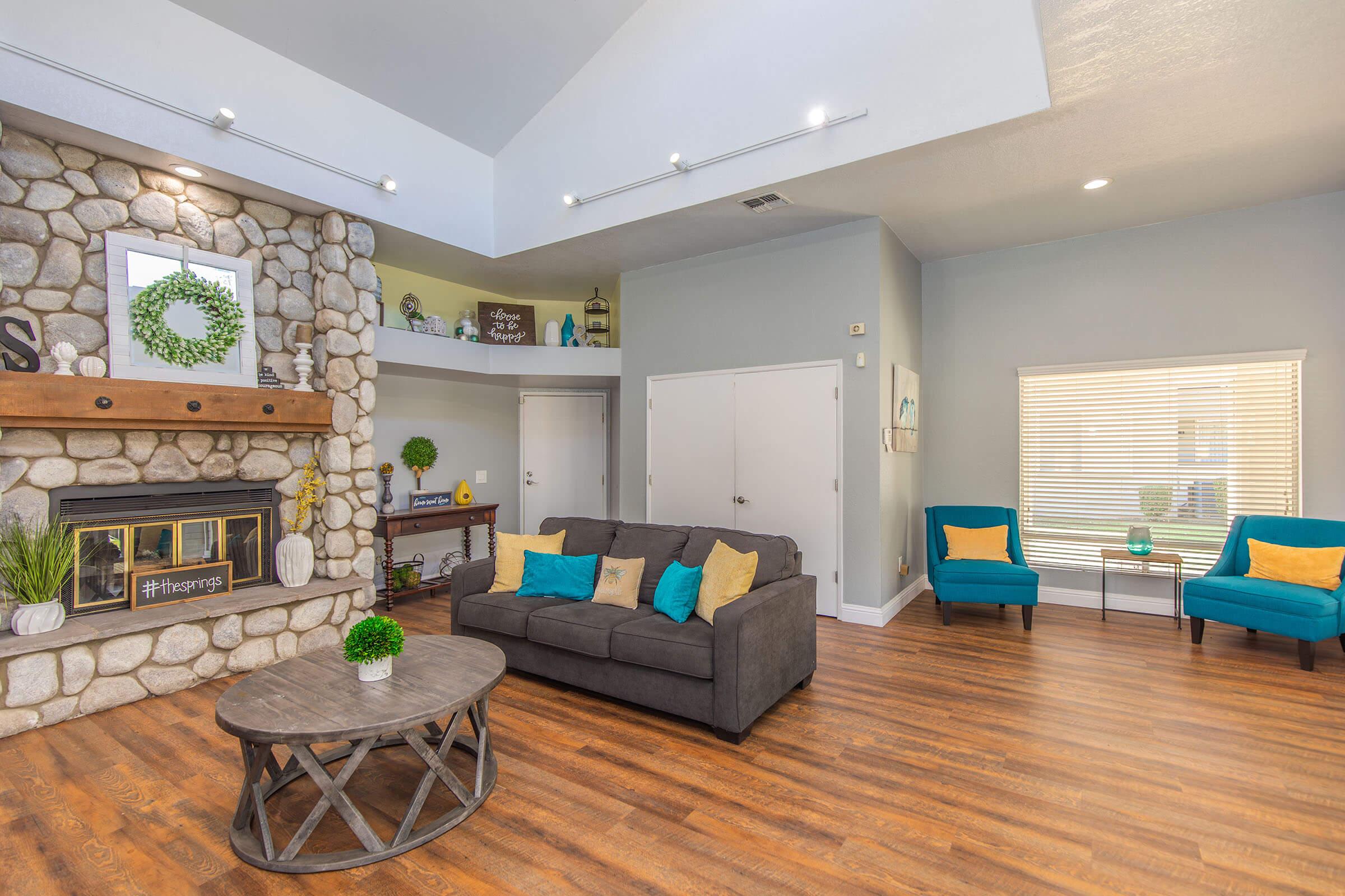 a living room filled with furniture and a fireplace