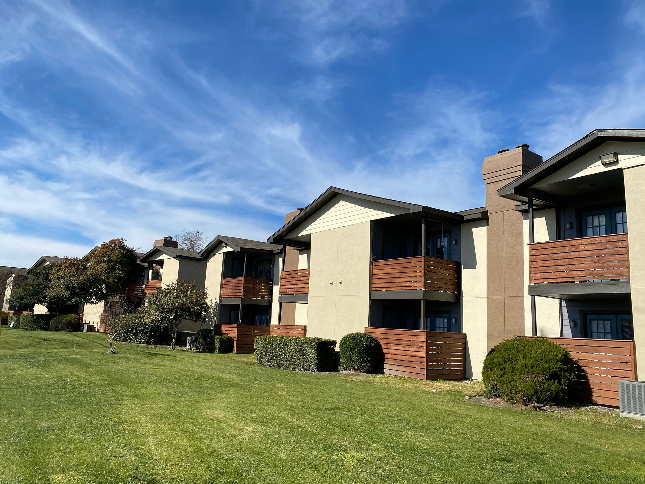a building with a grassy field