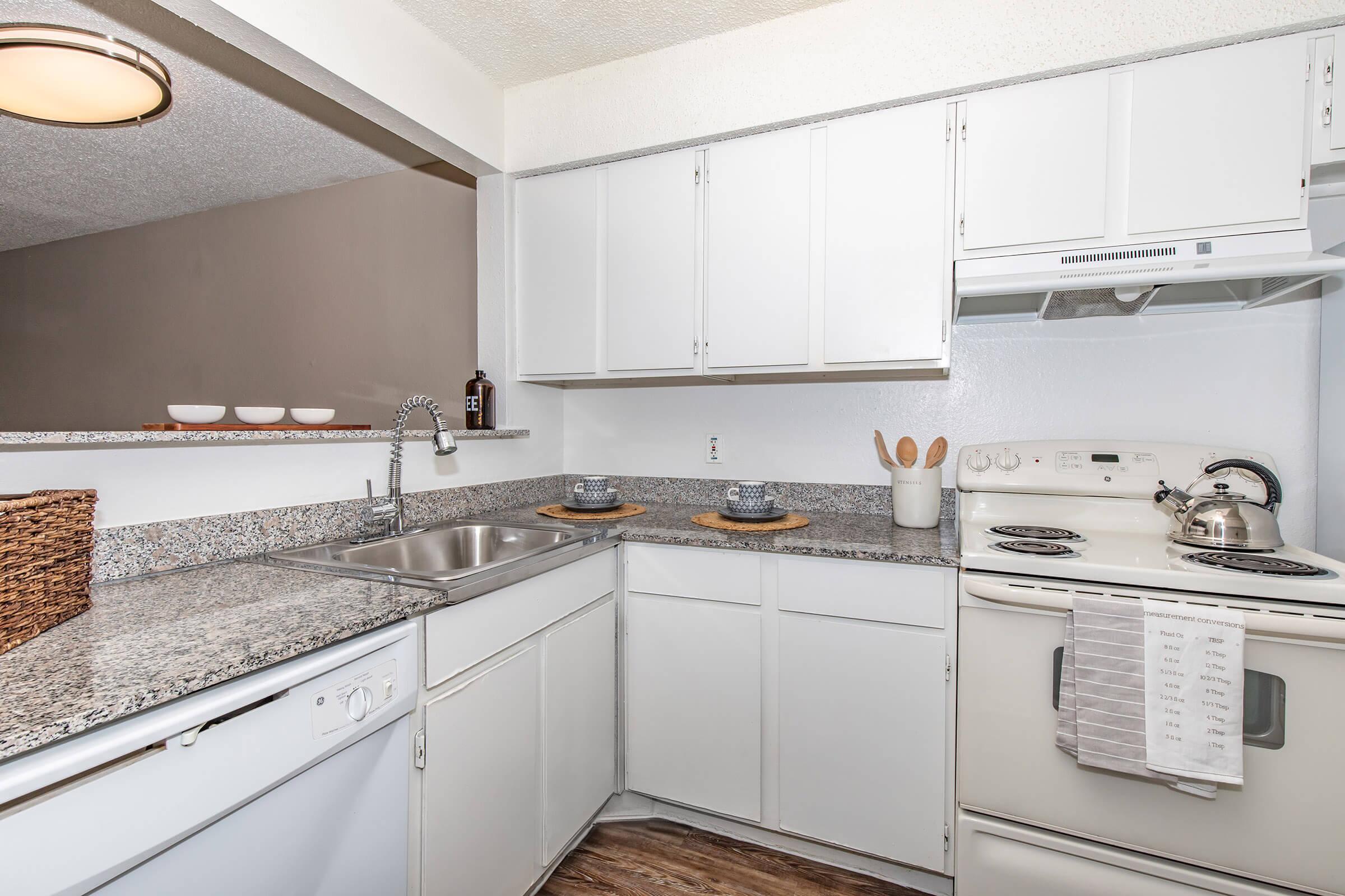 a kitchen with a sink and a microwave