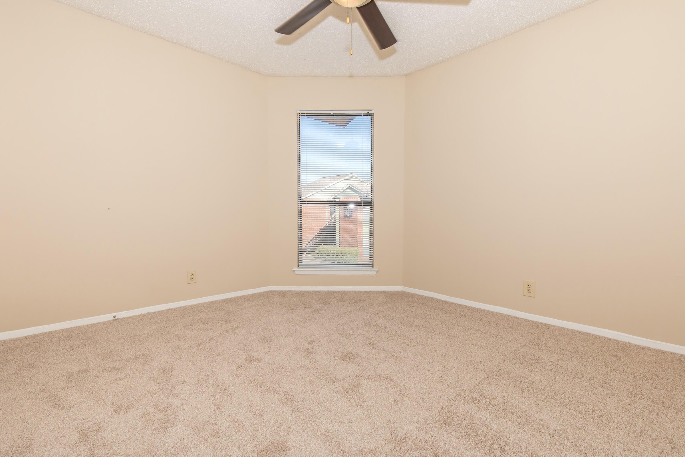 a bedroom with a bed in a room