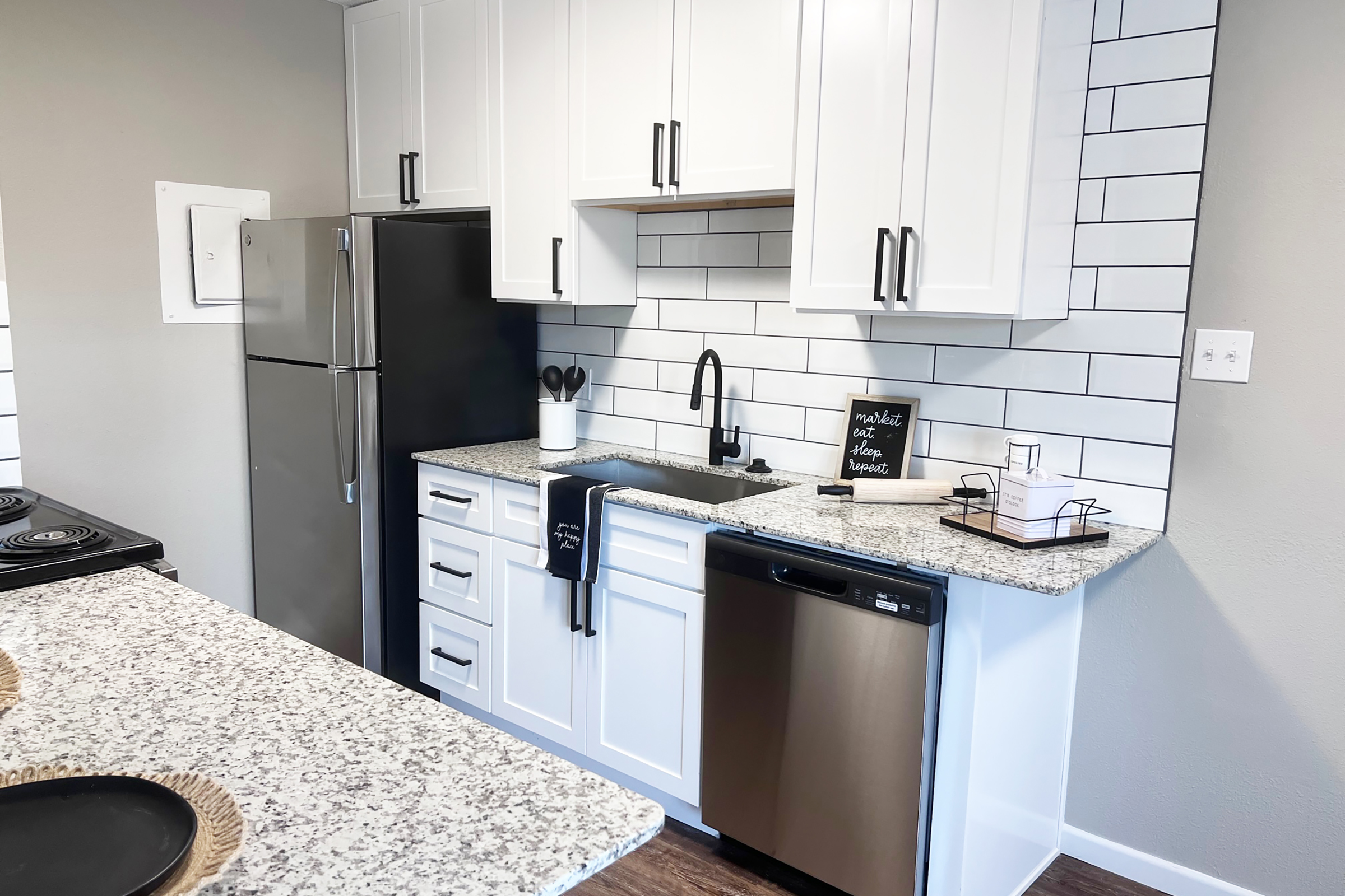 a modern kitchen with stainless steel appliances