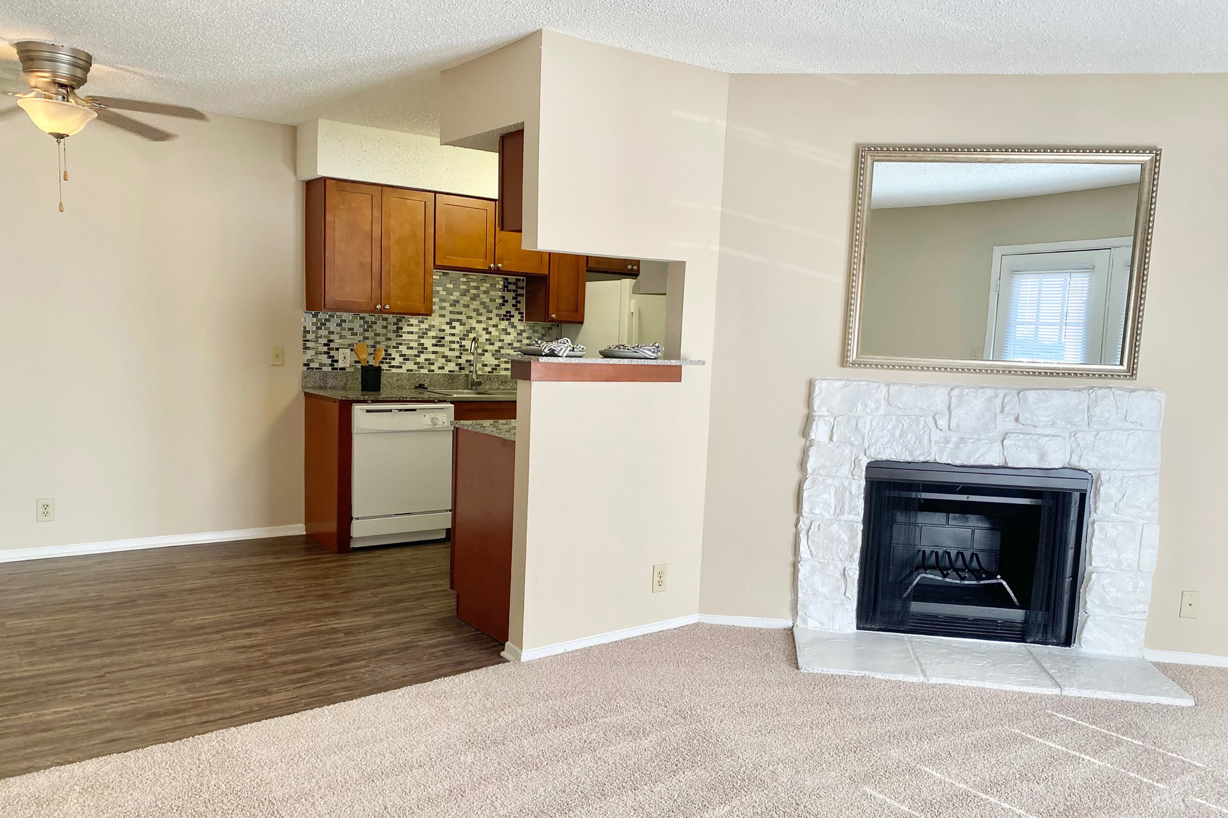 a living room filled with furniture and a fireplace