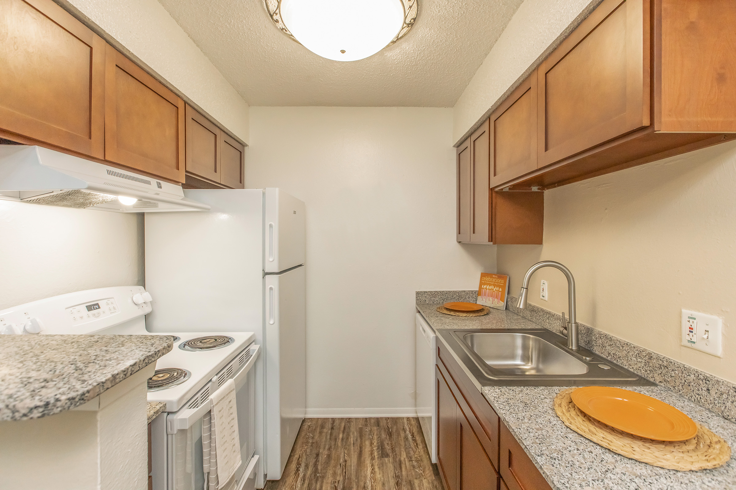 a kitchen with a stove and a sink