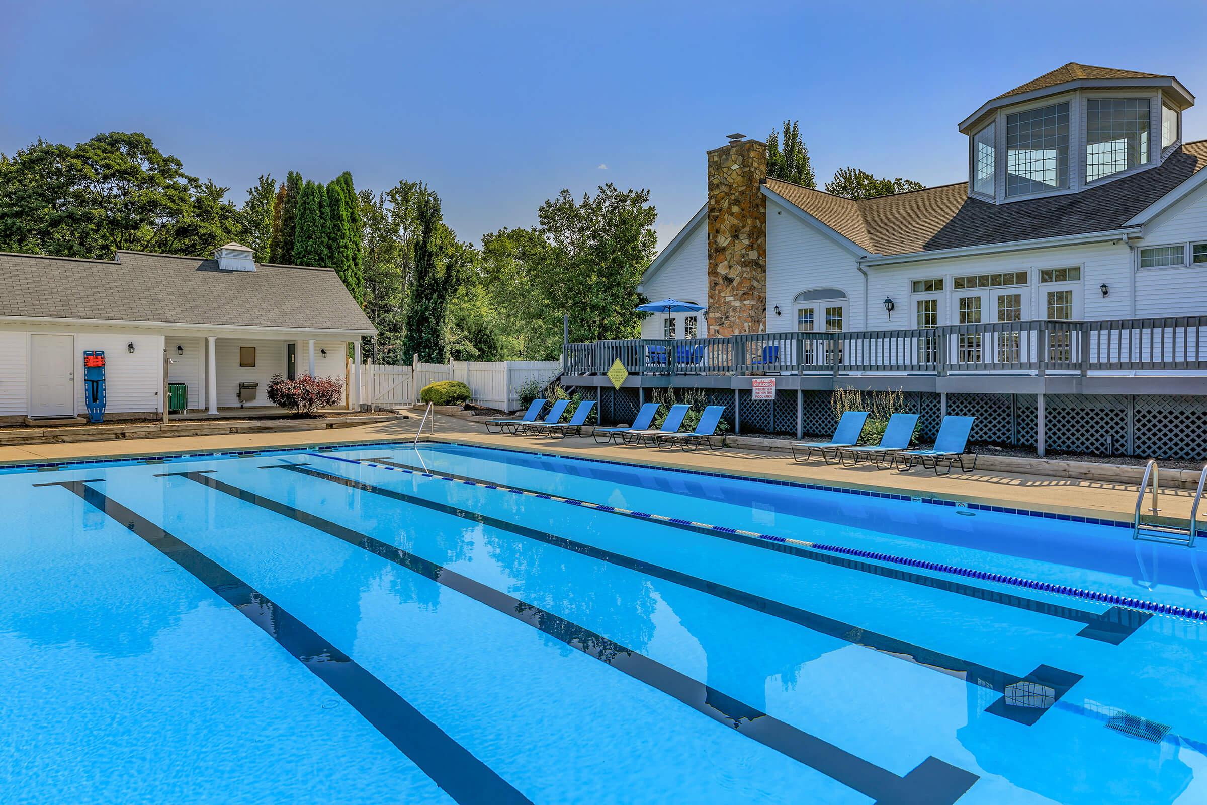 a large pool of water in front of a house