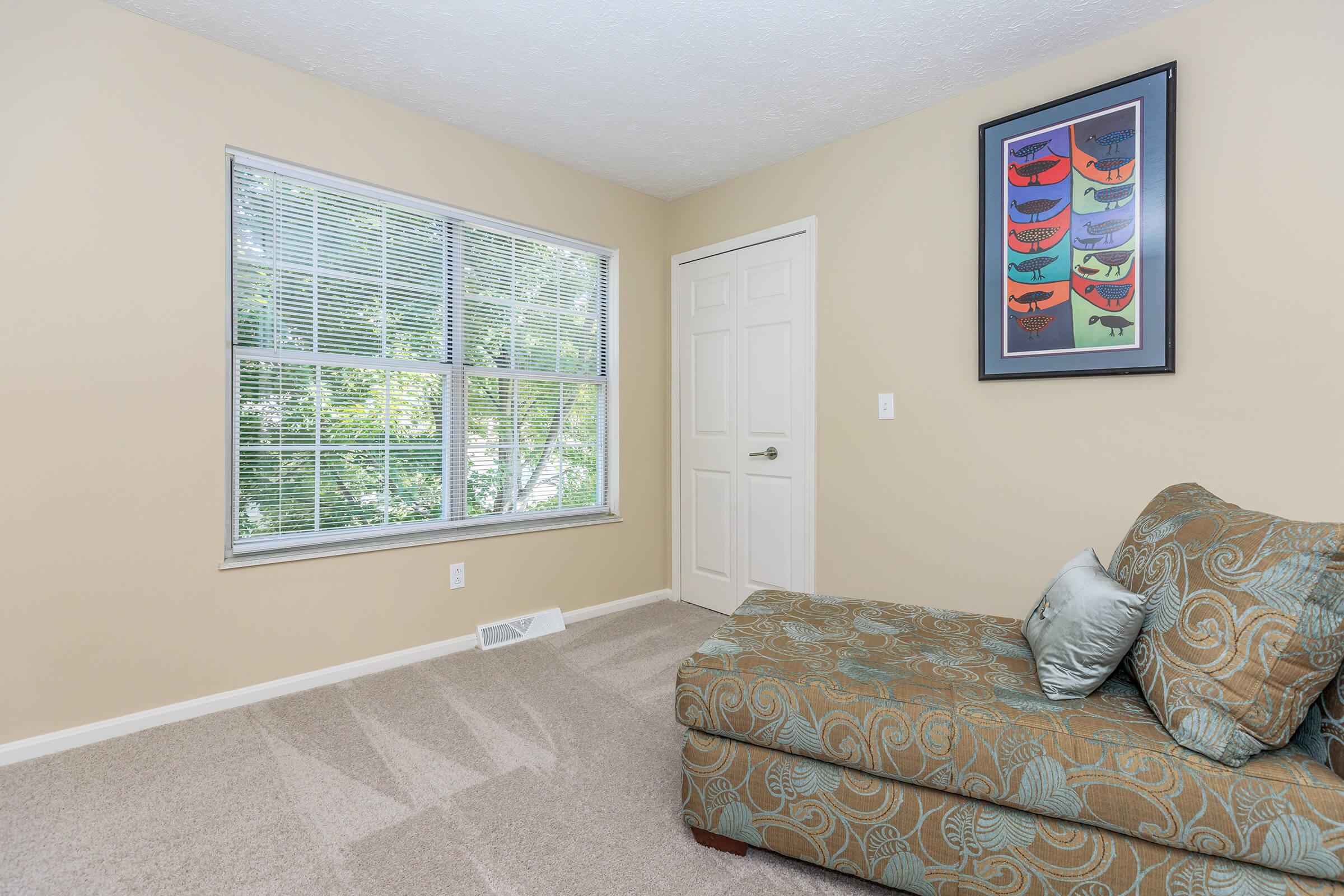 a living room next to a window