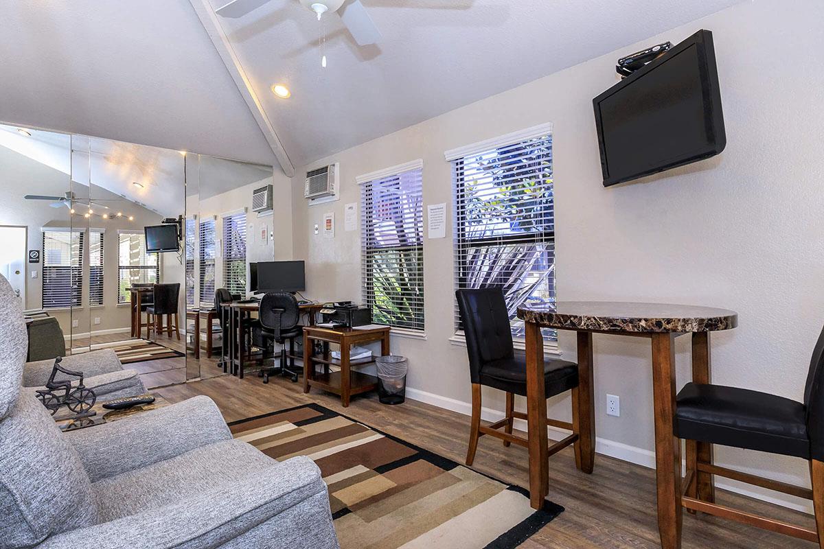 a living room filled with furniture and a fireplace