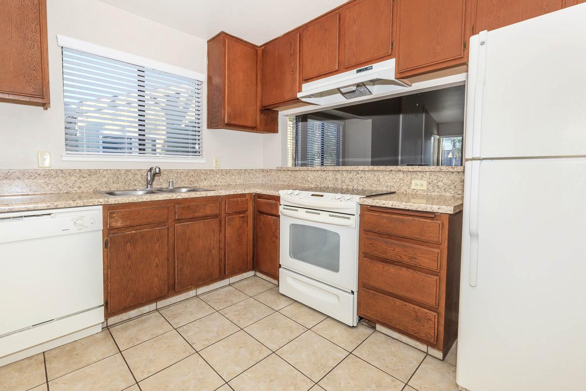 a kitchen with a refrigerator stove and microwave