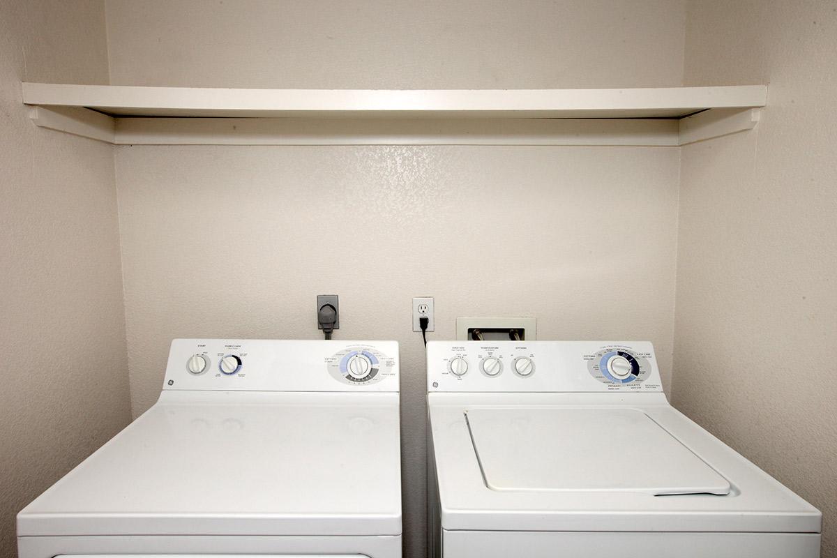 a white microwave oven sitting on top of a stove