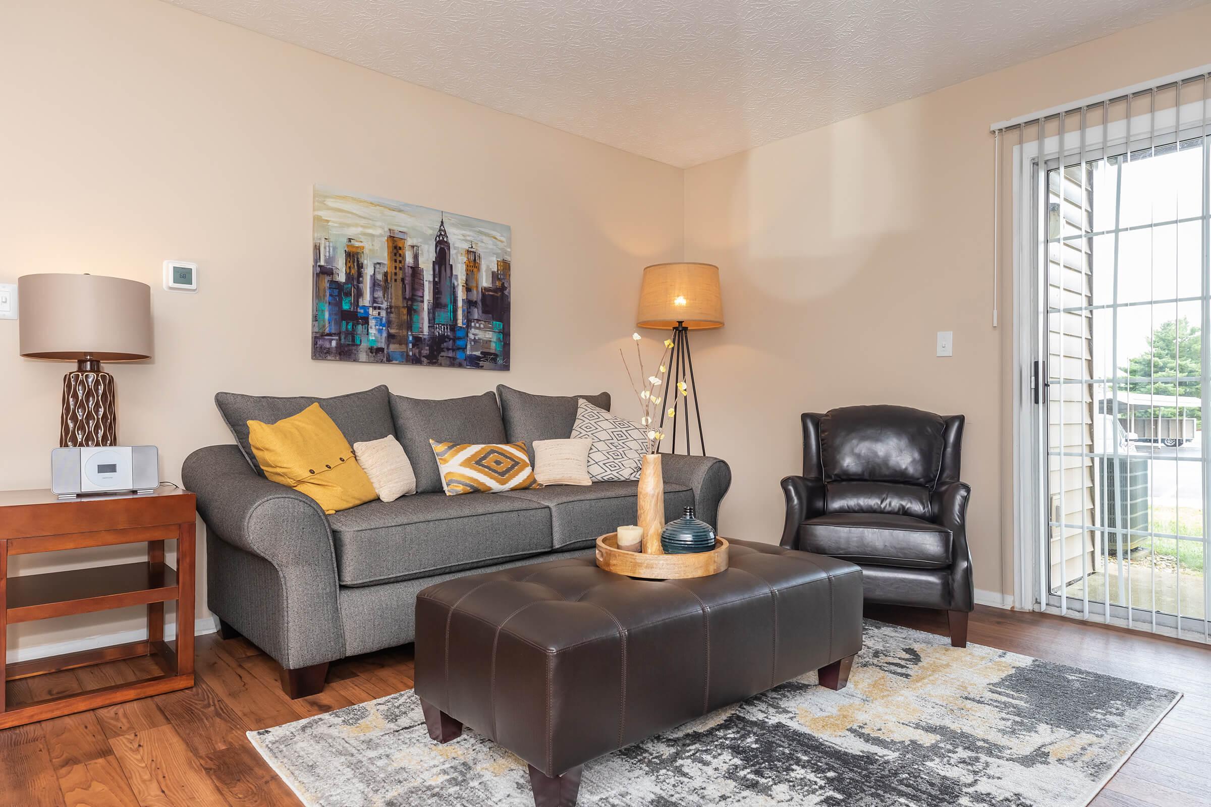 a living room filled with furniture and a fireplace