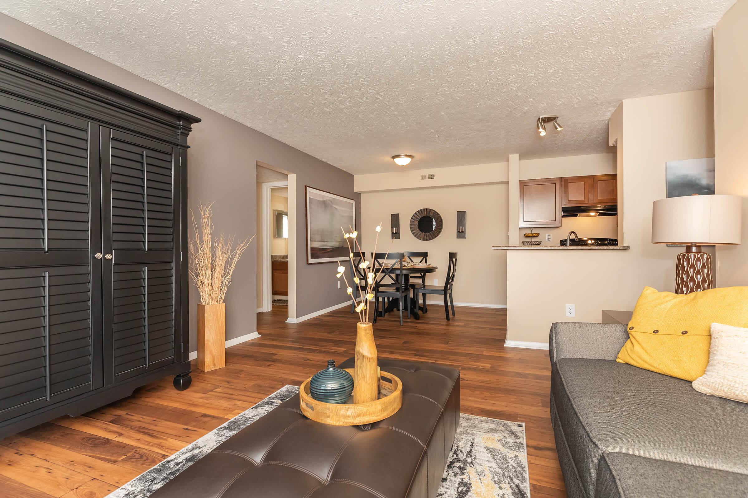 a living room filled with furniture and a large window