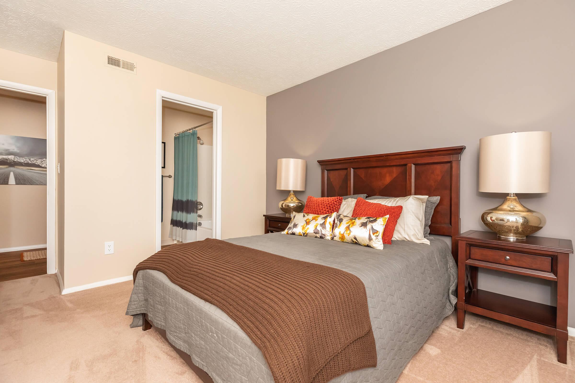 a bedroom with a large bed in a room
