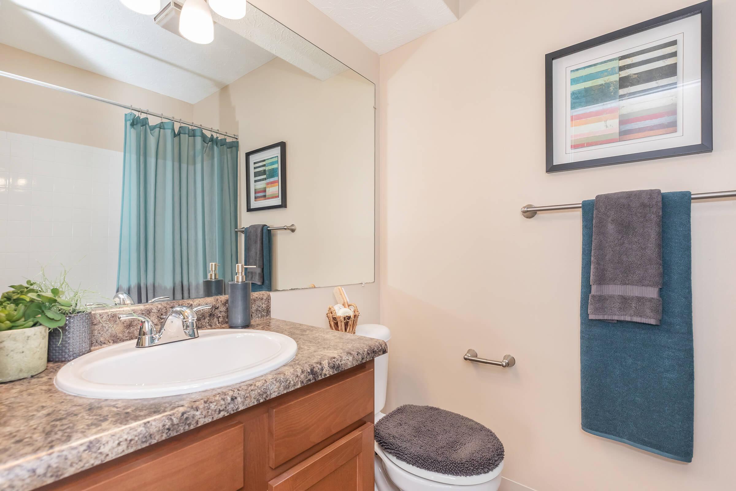a large white tub next to a sink