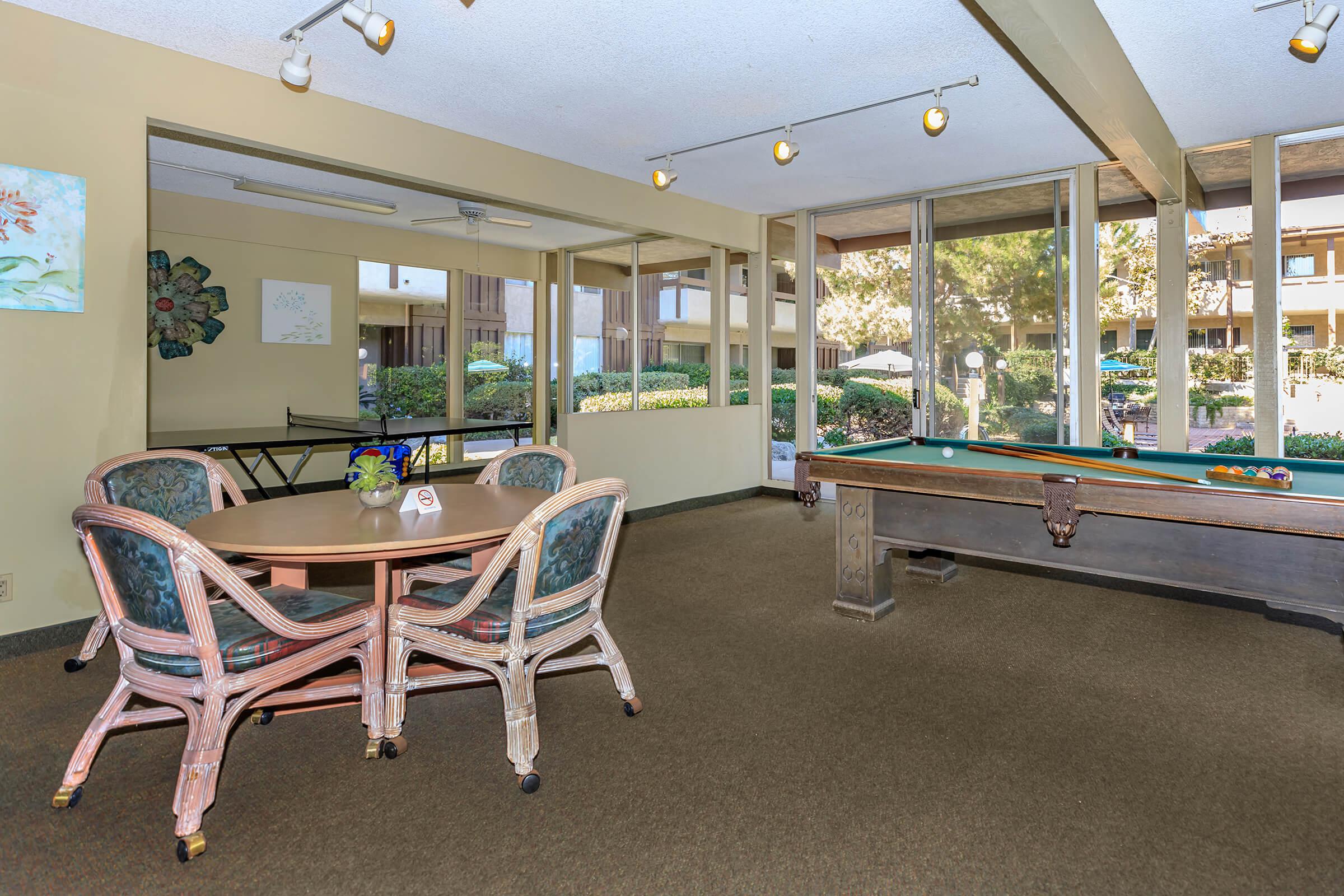 Emerald Victoria Apartments community room with a pool table