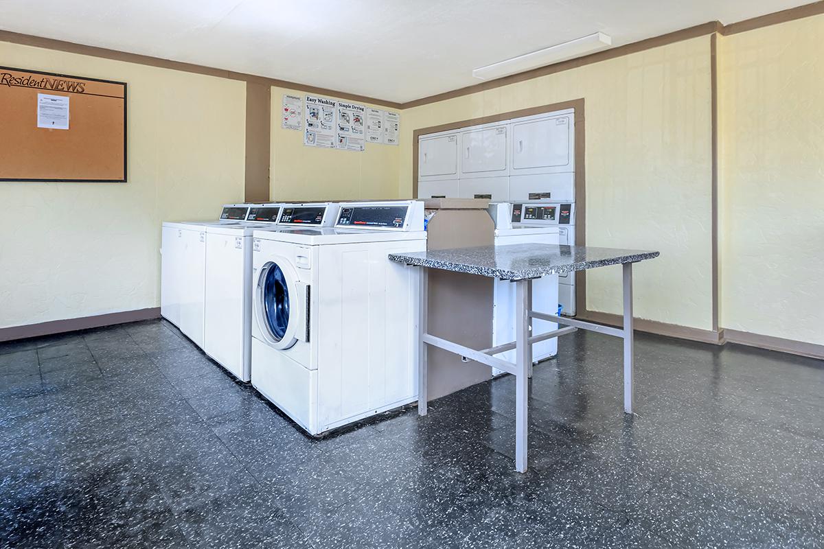 a white refrigerator freezer sitting inside of a kitchen